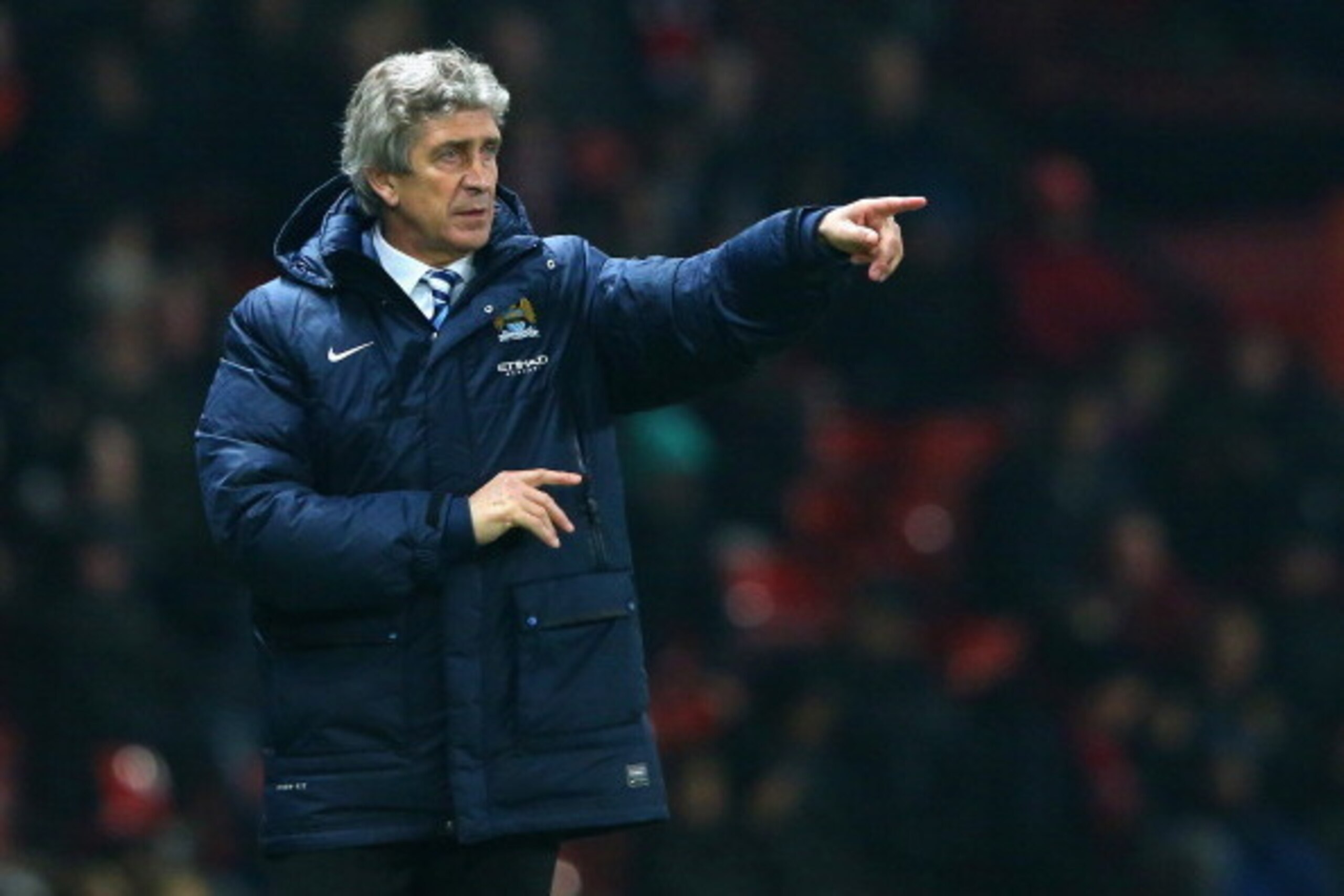 MANCHESTER, ENGLAND - MARCH 25:  Manchester City Manager Manuel Pellegrini gestures during the Barclays Premier League match between Manchester United and Manchester City at Old Trafford on March 25, 2014 in Manchester, England.  (Photo by Alex Livesey/Ge