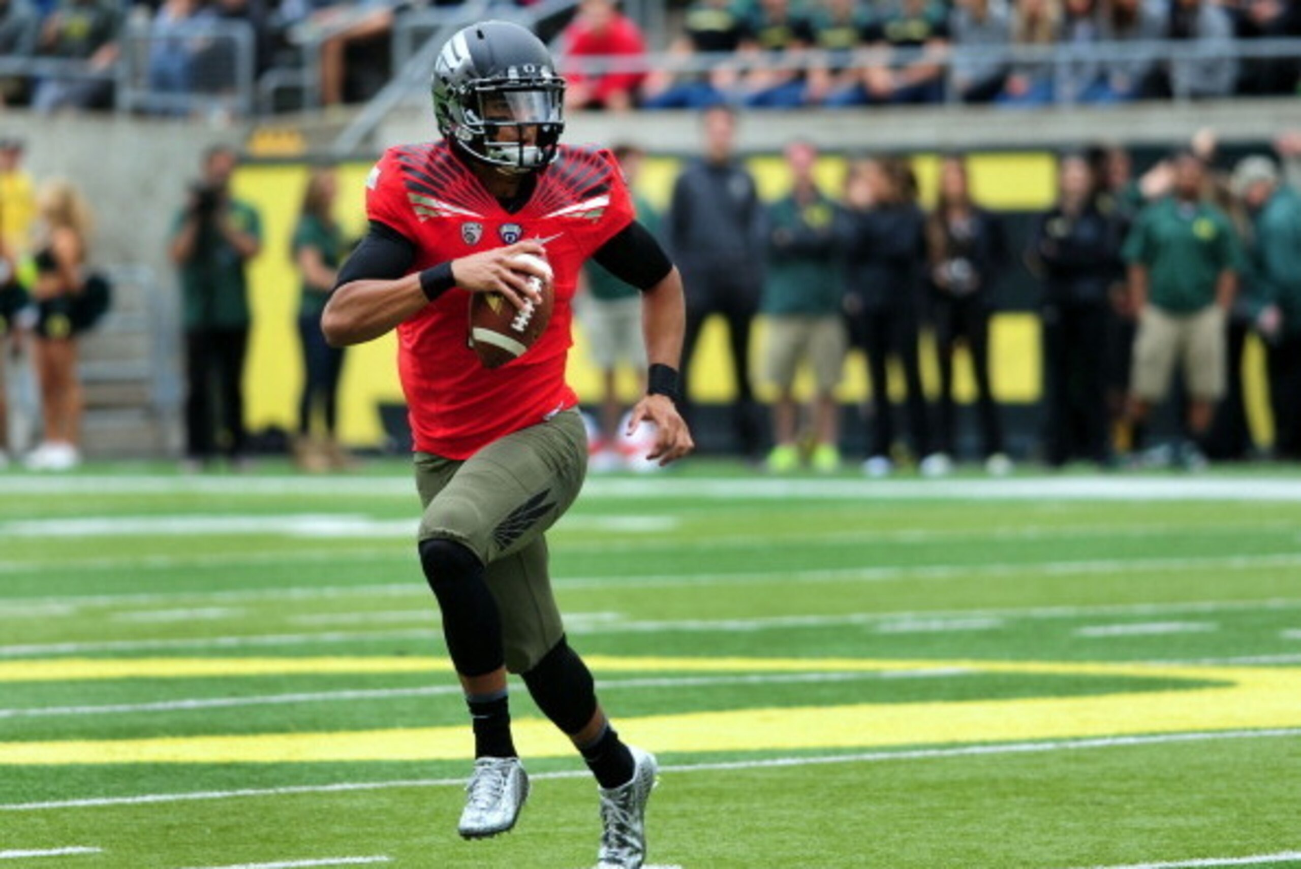 EUGENE, OR - MAY 3: Quarterback Marcus Mariota #8 of the Oregon Ducks runs with the ball during the spring game at Autzen Stadium on May 3, 2014 in Eugene, Oregon. (Photo by Steve Dykes/Getty Images)