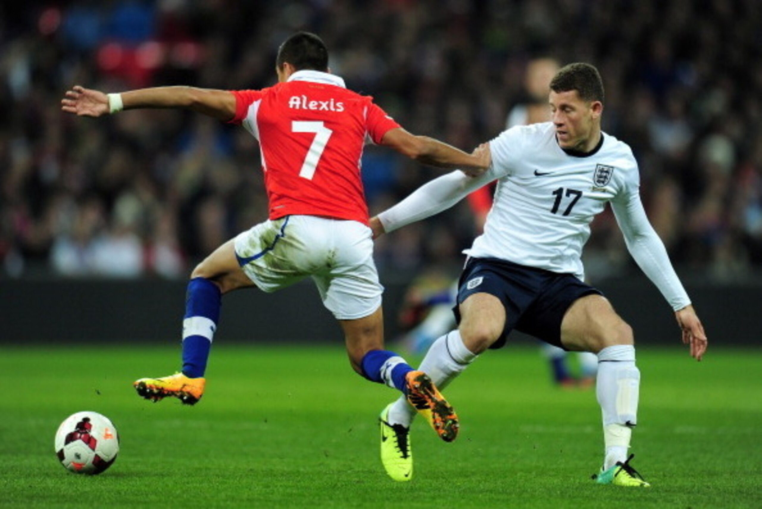 LONDON, ENGLAND - NOVEMBER 15:  Alexis Sanchez of Chile goes past Ross Barkley of England during the international friendly match between England and Chile at Wembley Stadium on November 15, 2013 in London, England.  (Photo by Shaun Botterill/Getty Images