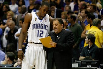 ORLANDO, FL - JUNE 11:  Dwight Howard #12 listens to head coach Stan Van Gundy of the Orlando Magic in Game Four of the 2009 NBA Finals against the Los Angeles Lakers on June 11, 2009 at Amway Arena in Orlando, Florida.  NOTE TO USER:  User expressly ackn