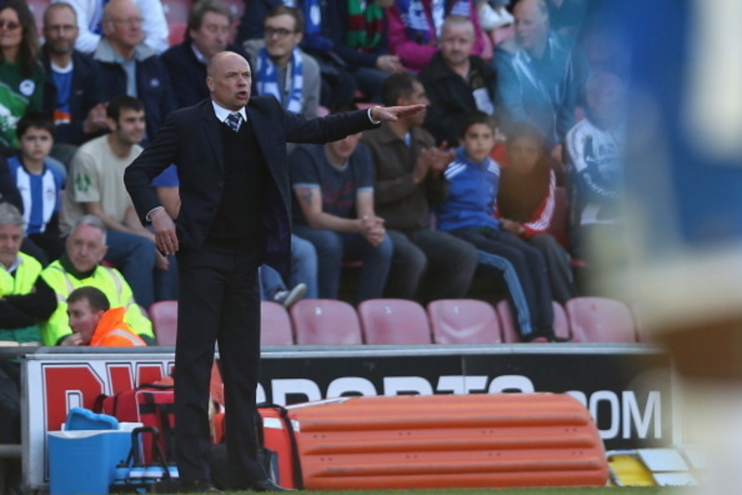 WIGAN, ENGLAND - APRIL 18:  Wigan Athletic manager Uwe Rosler shouts instructions to his team  during the Sky Bet Championship match between Wigan Athletic and Reading at DW Stadium on April 18, 2014 in Wigan, England.  (Photo by Clive Brunskill/Getty Ima