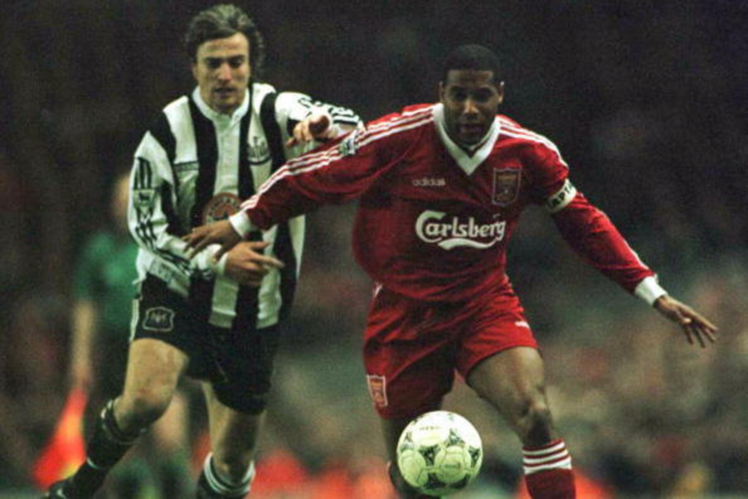 3 Apr 1996:  John Barnes of Liverpool battles for the ball with David Ginola of Newcastle United during their FA Premiership game at Anfield, Liverpool. Mandatory Credit: Allsport UK/Allsport