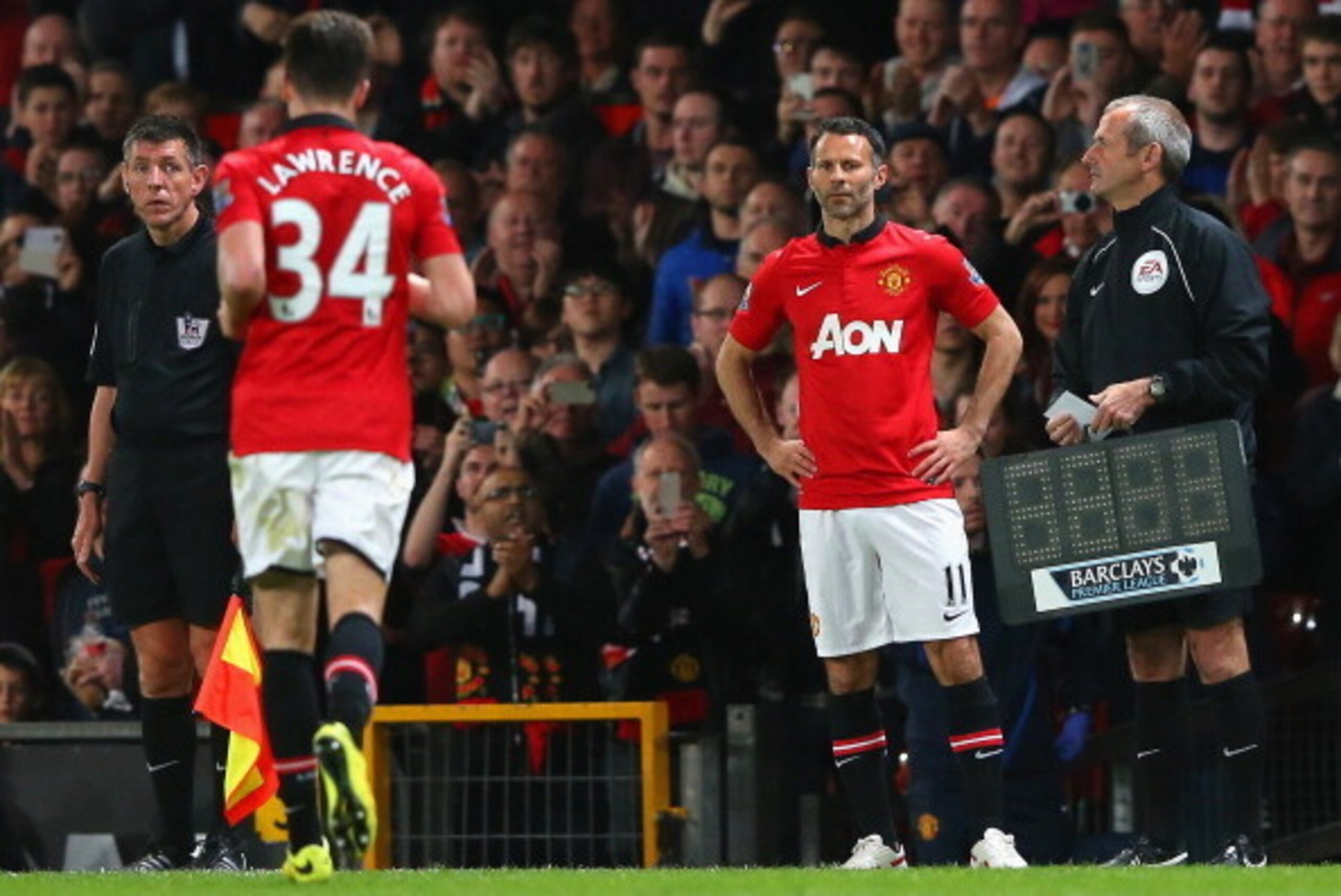 MANCHESTER, ENGLAND - MAY 06:  Manchester United Caretaker Manager Ryan Giggs prepares to come on as a substitute during the Barclays Premier League match between Manchester United and Hull City at Old Trafford on May 6, 2014 in Manchester, England.  (Pho