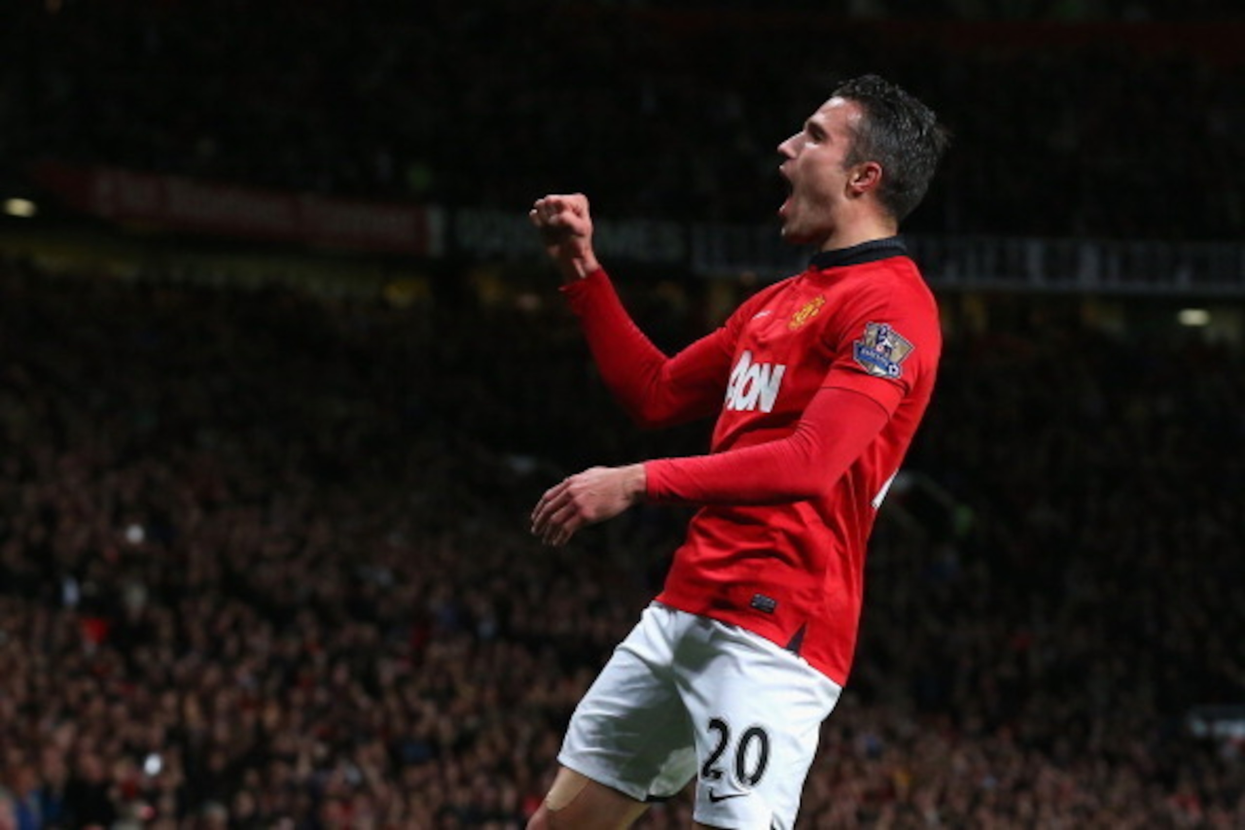 MANCHESTER, ENGLAND - MAY 06:  Robin van Persie of Manchester United celebrates scoring his team's third goal during the Barclays Premier League match between Manchester United and Hull City at Old Trafford on May 6, 2014 in Manchester, England.  (Photo b