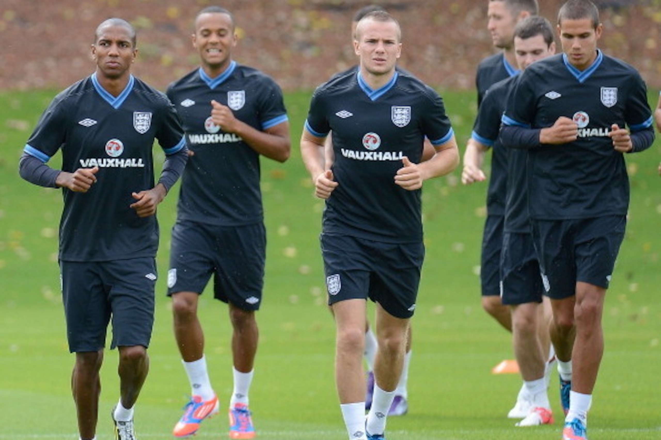 ST ALBANS, ENGLAND - AUGUST 13: Ashley Young, Tom Cleverley and Jack Rodwell of England warm up with their team-mates during England Training session at London Colney on August 13, 2012 in St Albans, England. (Photo by Tom Dulat/Getty Images)