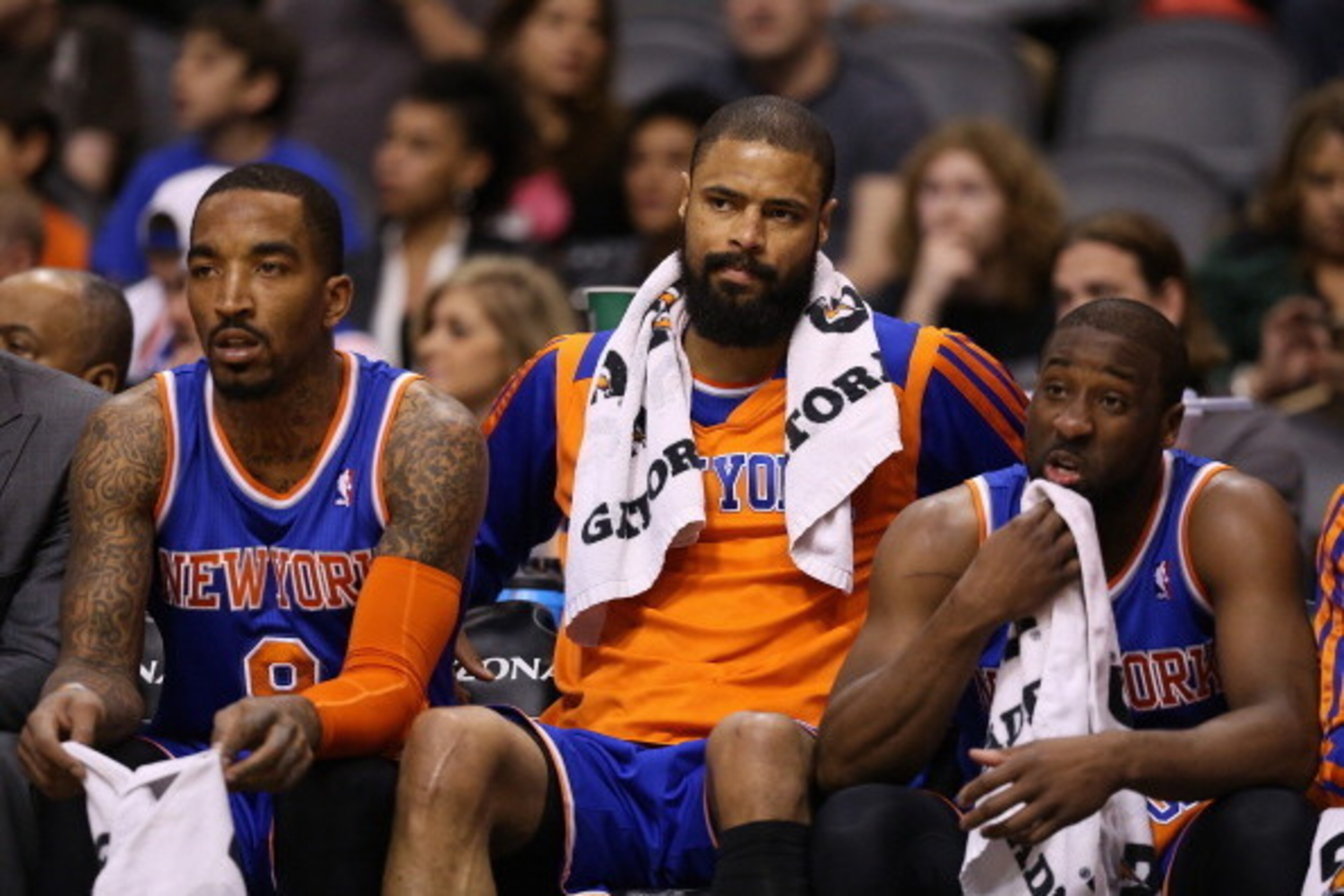 PHOENIX, AZ - MARCH 28:  (L-R) J.R. Smith #8, Tyson Chandler #6 and Raymond Felton #2 of the New York Knicks react on the bench during the second half of the NBA game against the Phoenix Suns at US Airways Center on March 28, 2014 in Phoenix, Arizona. The