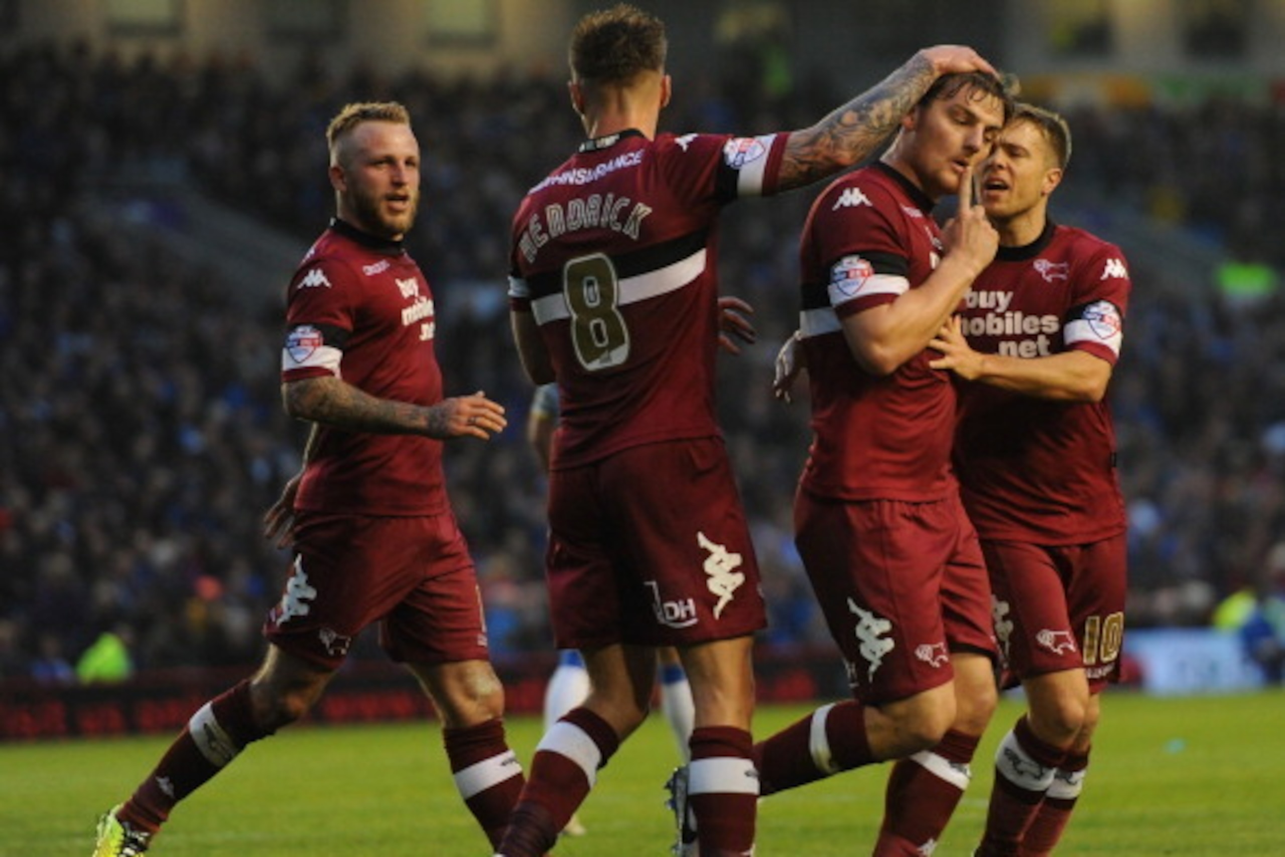 BRIGHTON, ENGLAND - MAY 08: Chris Martin of Derby County (2nd R) celebrates scoring from the penalty spot with his team mates during the Sky Bet Championship Play Off semi final first leg match between Brighton & Hove Albion and Derby County at Amex Stadi