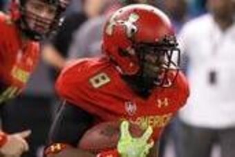 Jan 2, 2014; St. Petersburg, FL, USA; Team Highlight running back Racean Thomas (8) runs with the ball during the second half at Tropicana Field. Team Highlight defeated the Team Nitro 31-21. Mandatory Credit: Kim Klement-USA TODAY Sports