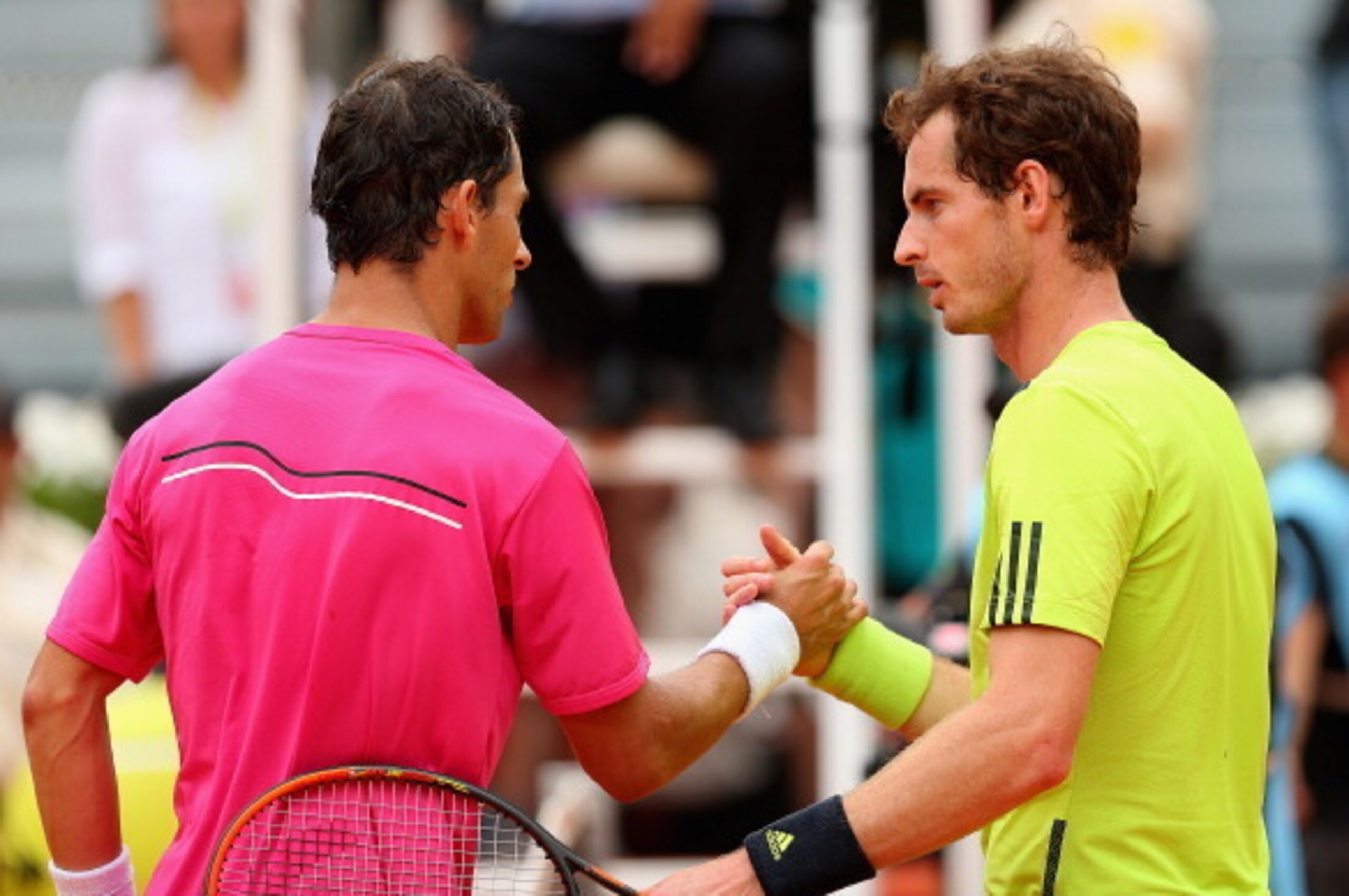 MADRID, SPAIN - MAY 08:  Andy Murray of Great Britain shakes hands at the net after his straight sets defeat by Santiago Giraldo of Columbia in their third round match during day six of the Mutua Madrid Open tennis tournament at the Caja Magica on May 8,