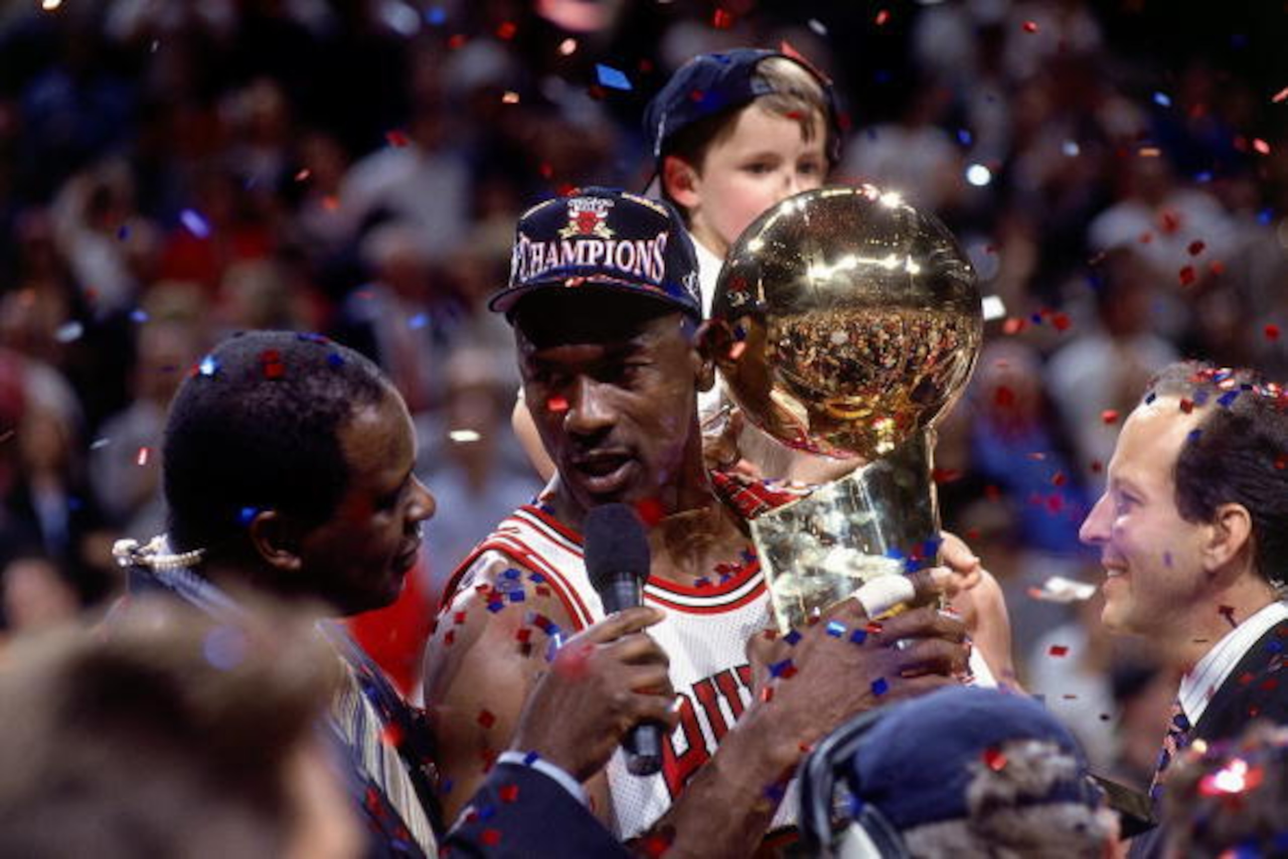 CHICAGO - JUNE 13:  Michael Jordan #23 of the Chicago Bulls celebrates with the championship trophy after defeating the Utah Jazz in Game six of the 1997 NBA Finals at the United Center on June 13, 1997 in Chicago, Illinois.  The Bulls won 90-86. NOTE TO 