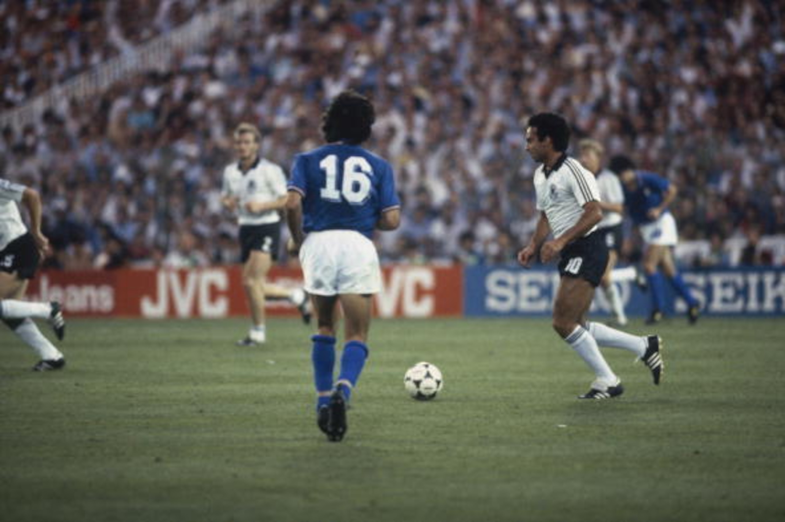 MADRID - JULY 11:  Hansi Muller of West Germany runs with the ball during the FIFA World Cup Finals 1982 Final between Italy and West Germany held on July 11, 1982 at the Bernabeu in Madrid, Spain. Italy won the match and trophy 3-1. (Photo by Steve Powel