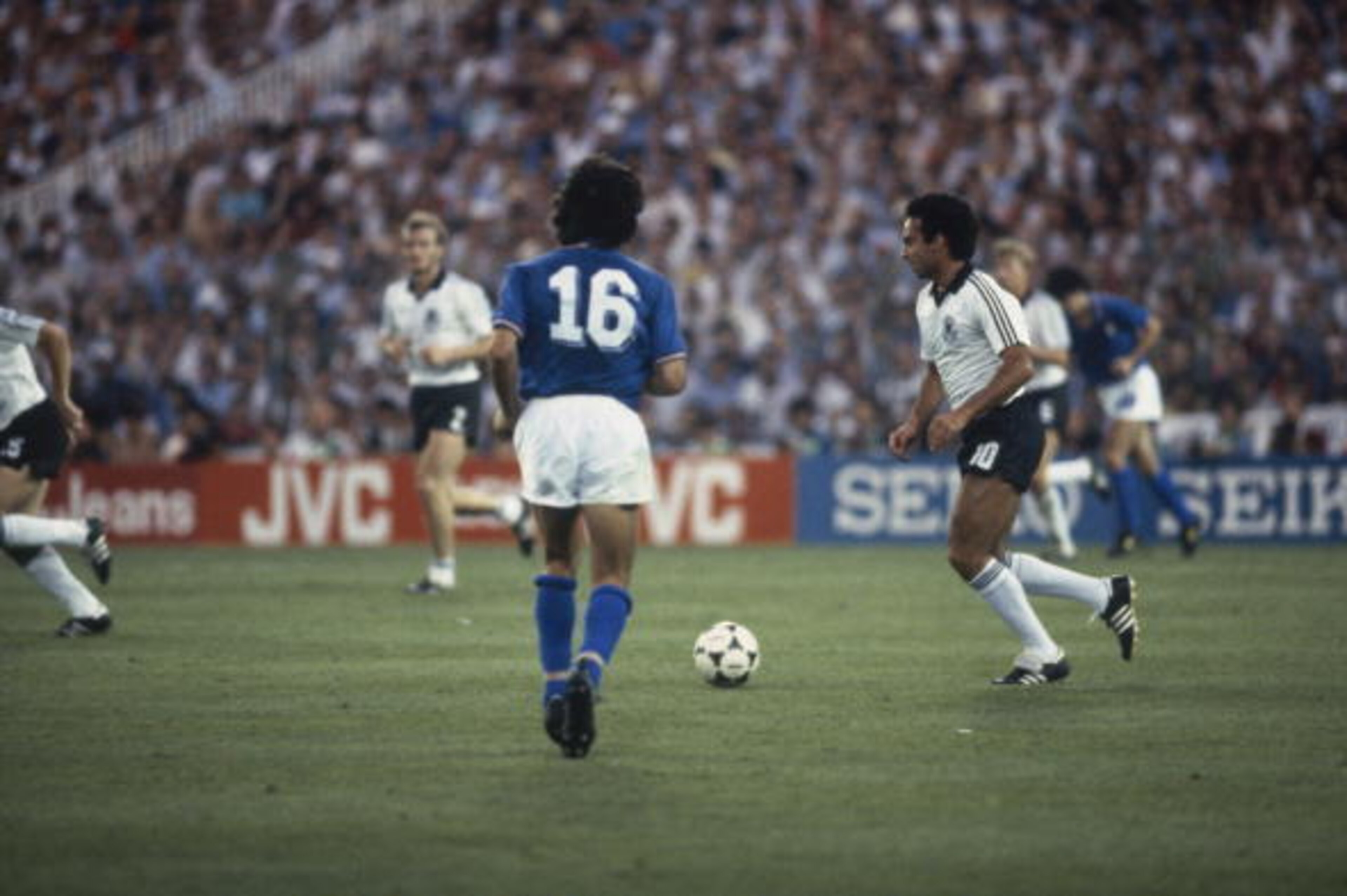 MADRID - JULY 11: Hansi Muller of West Germany runs with the ball during the FIFA World Cup Finals 1982 Final between Italy and West Germany held on July 11, 1982 at the Bernabeu in Madrid, Spain. Italy won the match and trophy 3-1. (Photo by Steve Powel MADRID - JULY 11: Hansi Muller of West Germany runs with the ball during the FIFA World Cup Finals 1982 Final between Italy and West Germany held on July 11, 1982 at the Bernabeu in Madrid, Spain. Italy won the match and trophy 3-1. (Photo by Steve Powel
