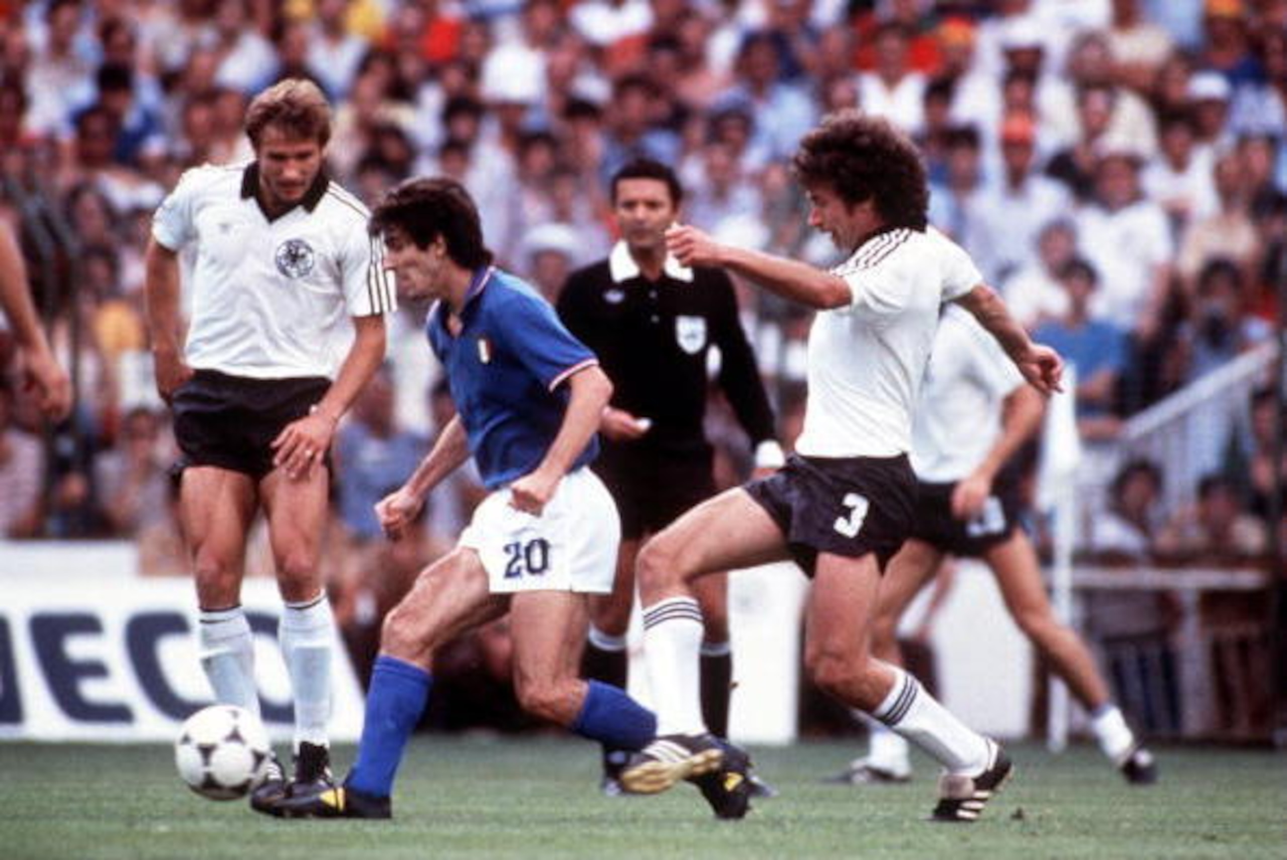 JUL 1982:  PAOLO ROSSI #20 OF ITALY IS HOUNDED BY PAUL BREITNER OF WEST GERMANY DURING THE ITALIANS 3-1 VICTORY IN THE 1982 WORLD CUP FINAL. Mandatory Credit: Tony Duffy/ALLSPORT