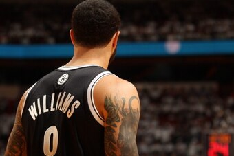 MIAMI, FL - May 8: Deron Williams #8 of the Brooklyn Nets during a game against the Miami Heat in Game Two of the Eastern Conference Semifinals of the 2014 NBA playoffs at the American Airlines Arena in Miami, Florida on May 8, 2014. NOTE TO USER: User ex