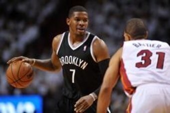May 6, 2014; Miami, FL, USA; Brooklyn Nets guard Joe Johnson (7) dribbles the ball against Miami Heat forward Shane Battier (31) during the second half in game one of the second round of the 2014 NBA Playoffs at American Airlines Arena. Mandatory Credit: 