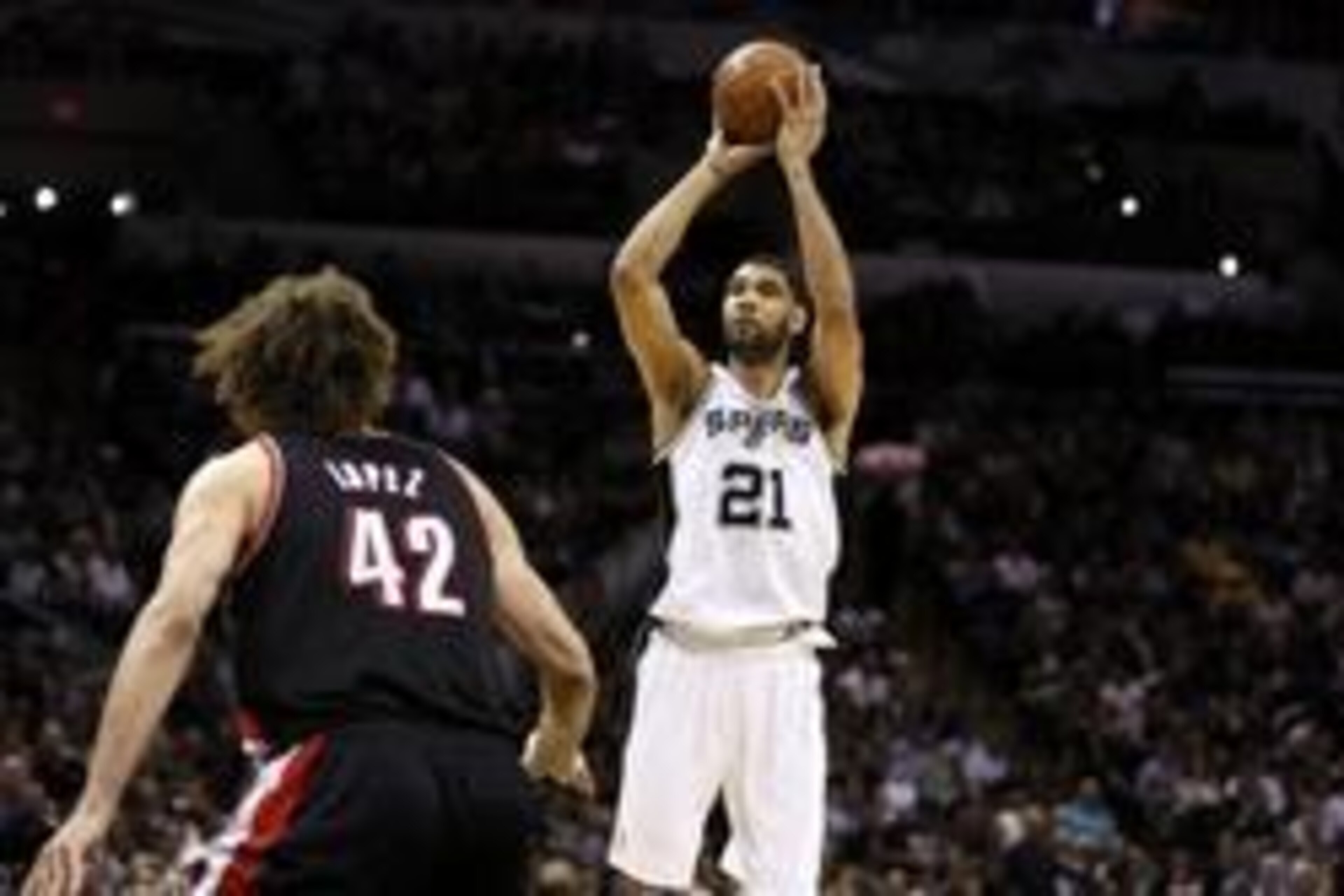 May 6, 2014; San Antonio, TX, USA; San Antonio Spurs forward Tim Duncan (21) shoots the ball over Portland Trail Blazers center Robin Lopez (42) in game one of the second round of the 2014 NBA Playoffs at AT&T Center. Mandatory Credit: Soobum Im-USA TODAY