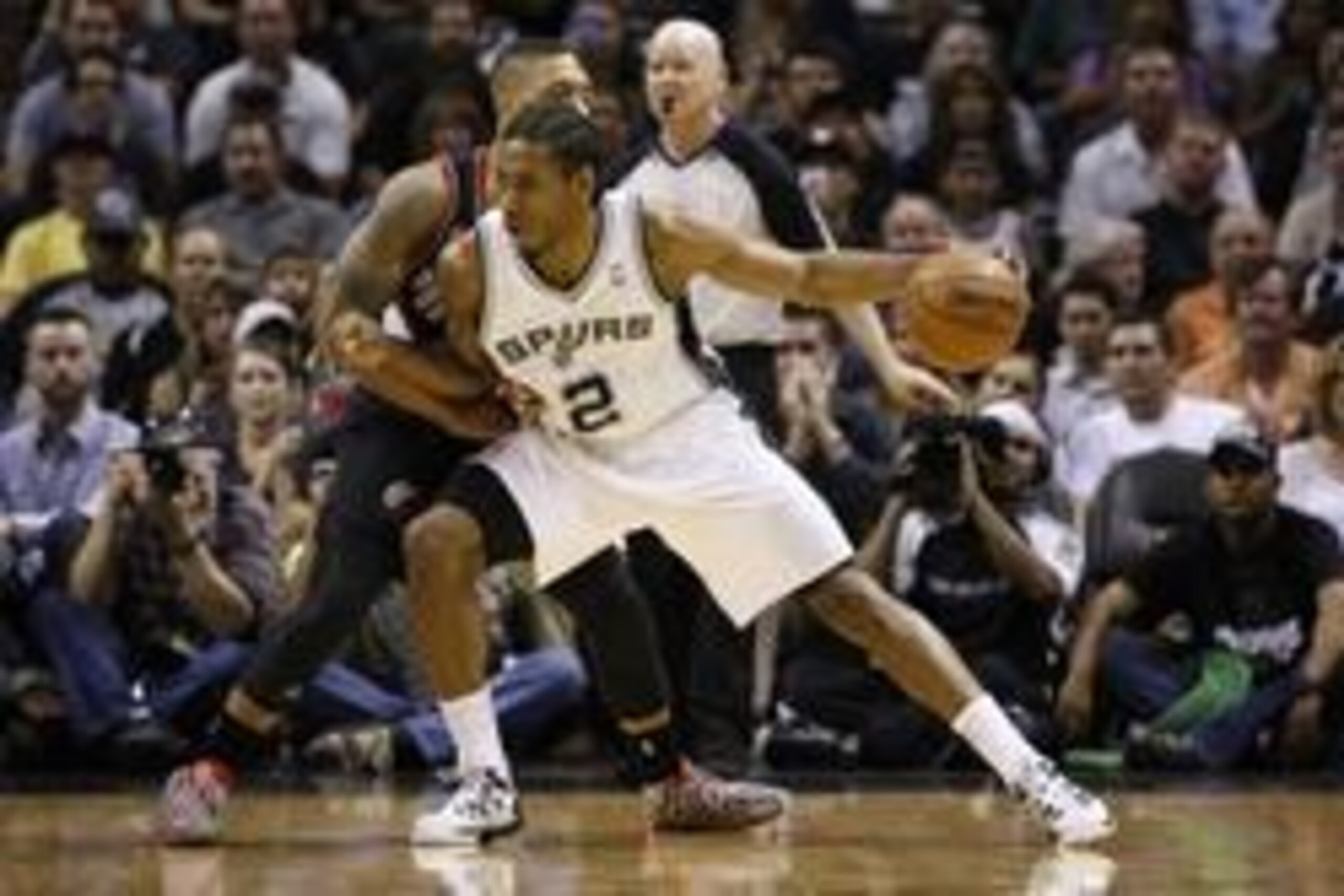 May 8, 2014; San Antonio, TX, USA; San Antonio Spurs forward Kawhi Leonard (2) posts up against Portland Trail Blazers guard Damian Lillard (left) in game two of the second round of the 2014 NBA Playoffs at AT&T Center. Mandatory Credit: Soobum Im-USA TOD