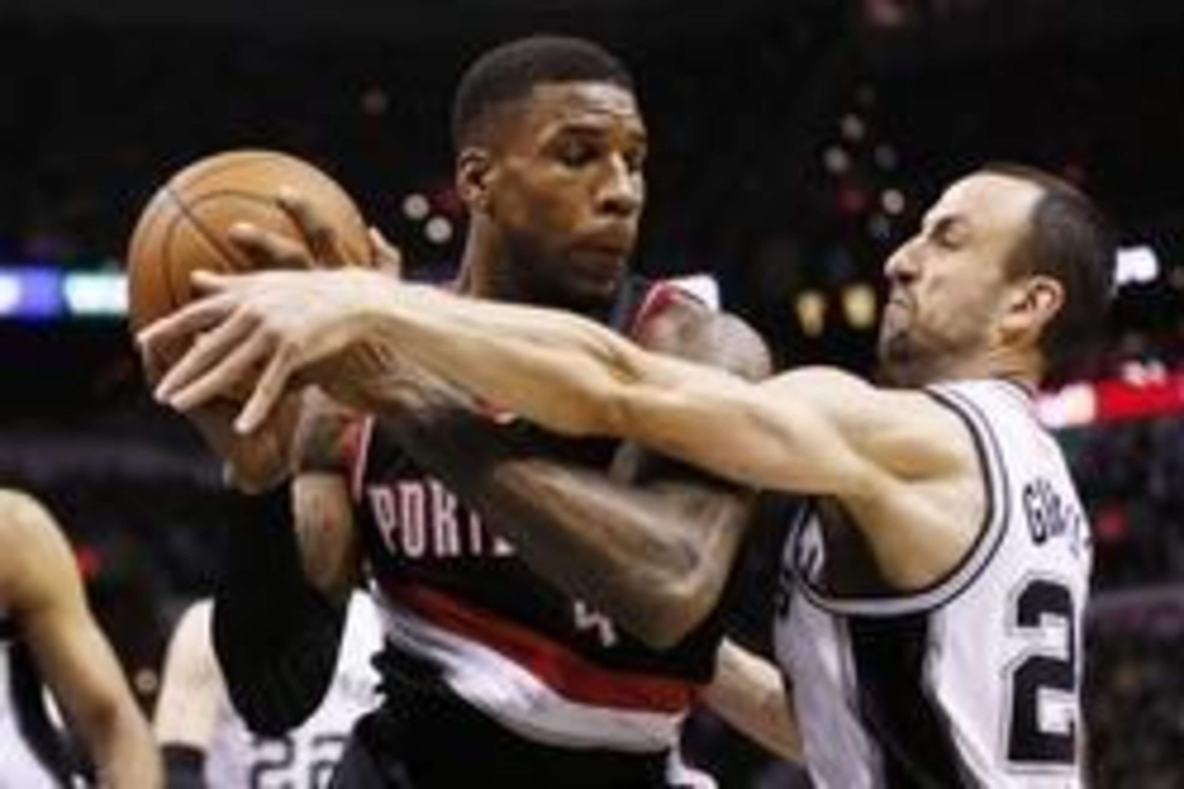 May 8, 2014; San Antonio, TX, USA; Portland Trail Blazers forward Thomas Robinson (41) is defended by San Antonio Spurs guard Manu Ginobili (20) in game two of the second round of the 2014 NBA Playoffs at AT&T Center. Mandatory Credit: Soobum Im-USA TODAY