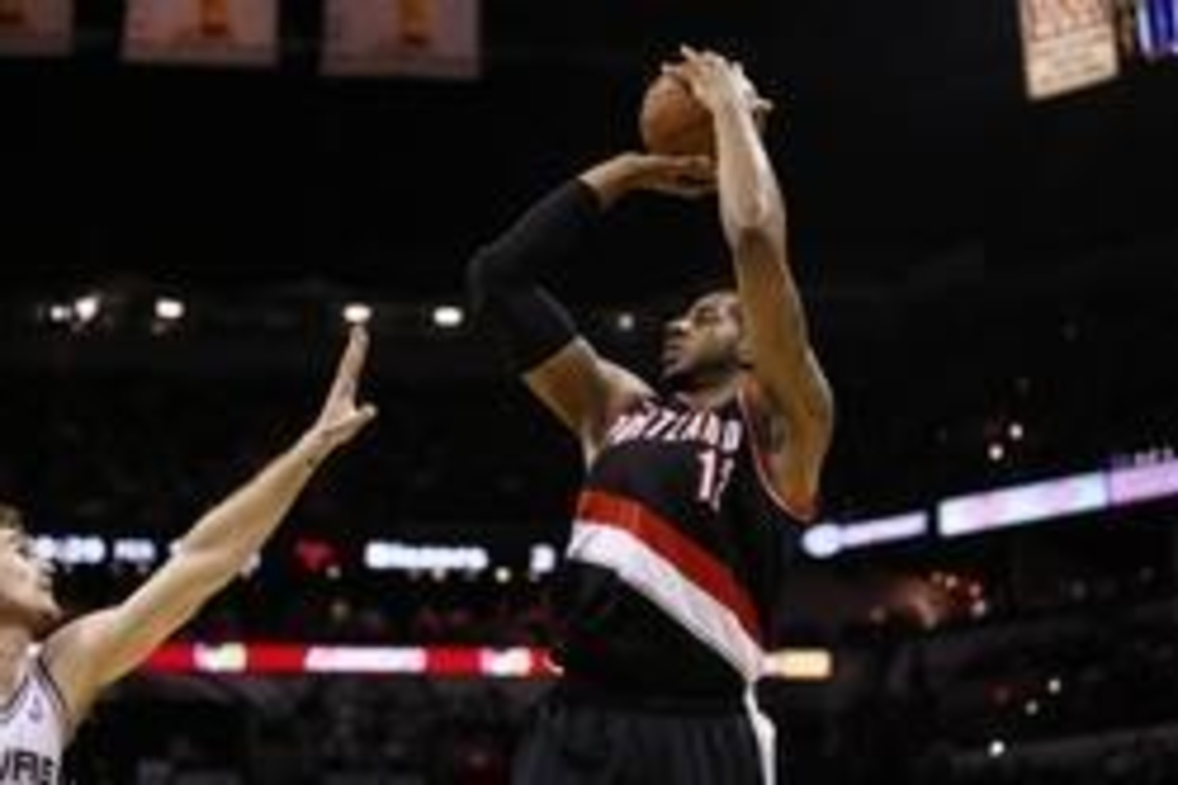 May 8, 2014; San Antonio, TX, USA; Portland Trail Blazers forward LaMarcus Aldridge (12) shoots the ball over San Antonio Spurs forward Tiago Splitter (left) in game two of the second round of the 2014 NBA Playoffs at AT&T Center. Mandatory Credit: Soobum