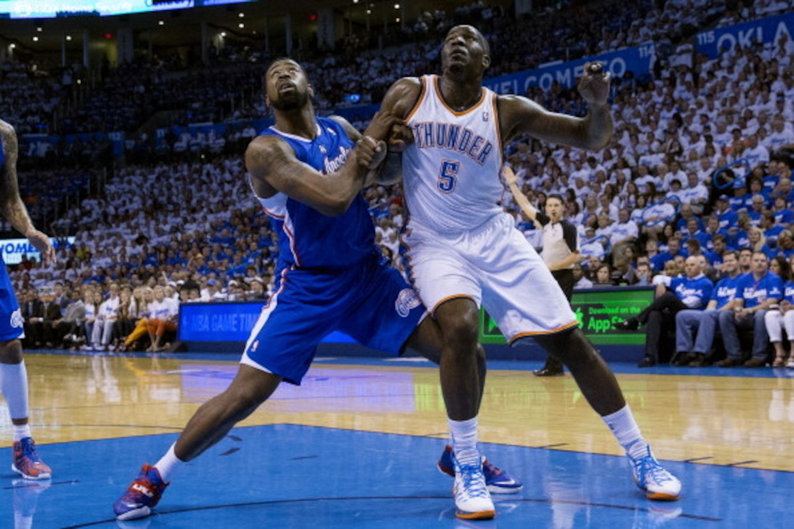 OKLAHOMA CITY, OK - May 7: DeAndre Jordan #6 of the Los Angeles Clippers battles for a rebound against Kendrick Perkins #5 of the Oklahoma City Thunder in Game 2 of the Western Conference Semifinals during the 2014 NBA Playoffs at the Chesapeake Arena on OKLAHOMA CITY, OK - May 7: DeAndre Jordan #6 of the Los Angeles Clippers battles for a rebound against Kendrick Perkins #5 of the Oklahoma City Thunder in Game 2 of the Western Conference Semifinals during the 2014 NBA Playoffs at the Chesapeake Arena on
