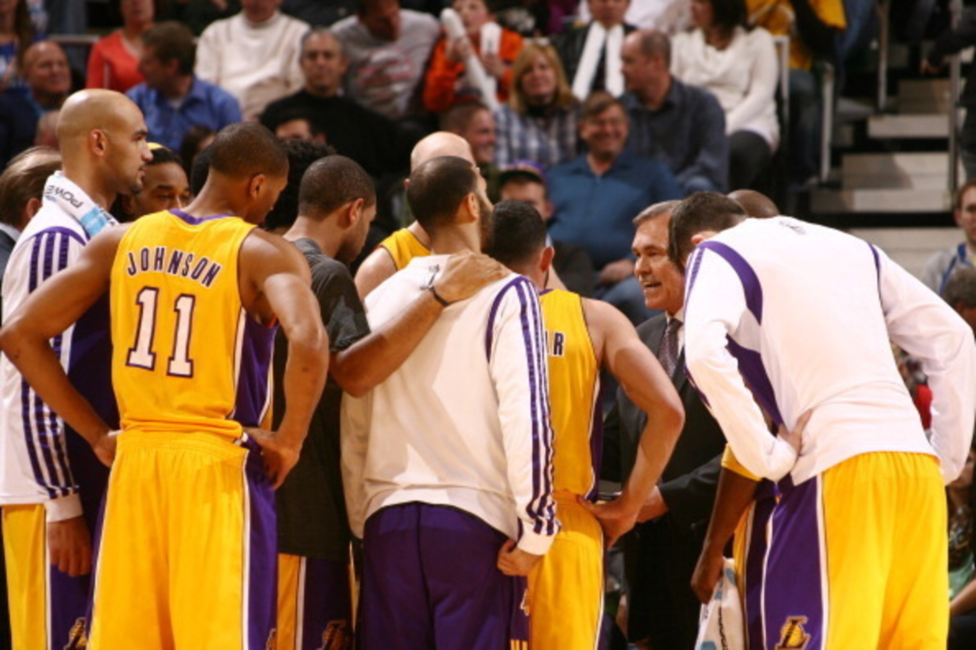 SALT LAKE CITY, UT - DECEMBER 27: Mike D'Antoni, Head Coach of the Los Angeles Lakers meets with players during a break in play against the Utah Jazz at EnergySolutions Arena on December 27, 2013 in Salt Lake City, Utah. NOTE TO USER: User expressly ackno