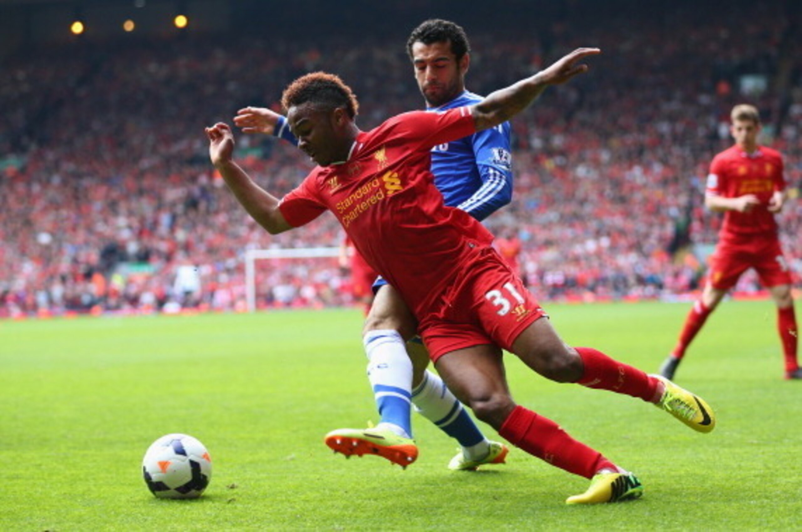 LIVERPOOL, ENGLAND - APRIL 27:  Mohamed Salah of Chelsea closes down Raheem Sterling of Liverpool  during the Barclays Premier League match between Liverpool and Chelsea at Anfield on April 27, 2014 in Liverpool, England.  (Photo by Clive Brunskill/Getty 