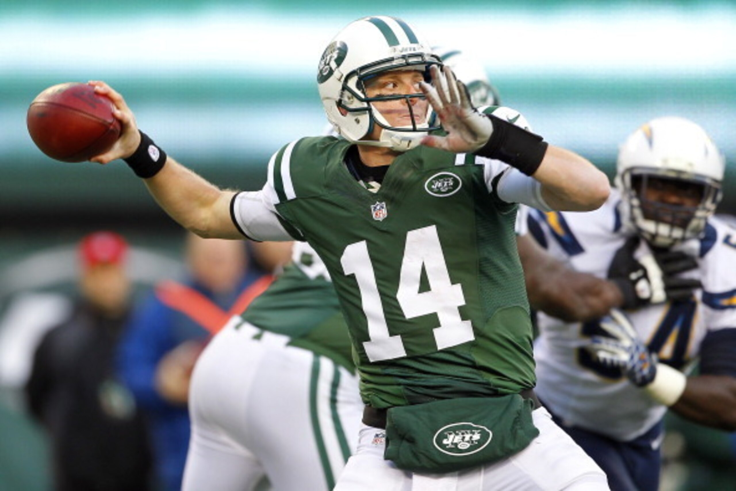 EAST RUTHERFORD, NJ - DECEMBER 23: Quarterback Greg McElroy #14 of the New York Jets looks to pass against the San Diego Chargers during the second half at MetLife Stadium on December 23, 2012 in East Rutherford, New Jersey. The Chargers defeated the Jets