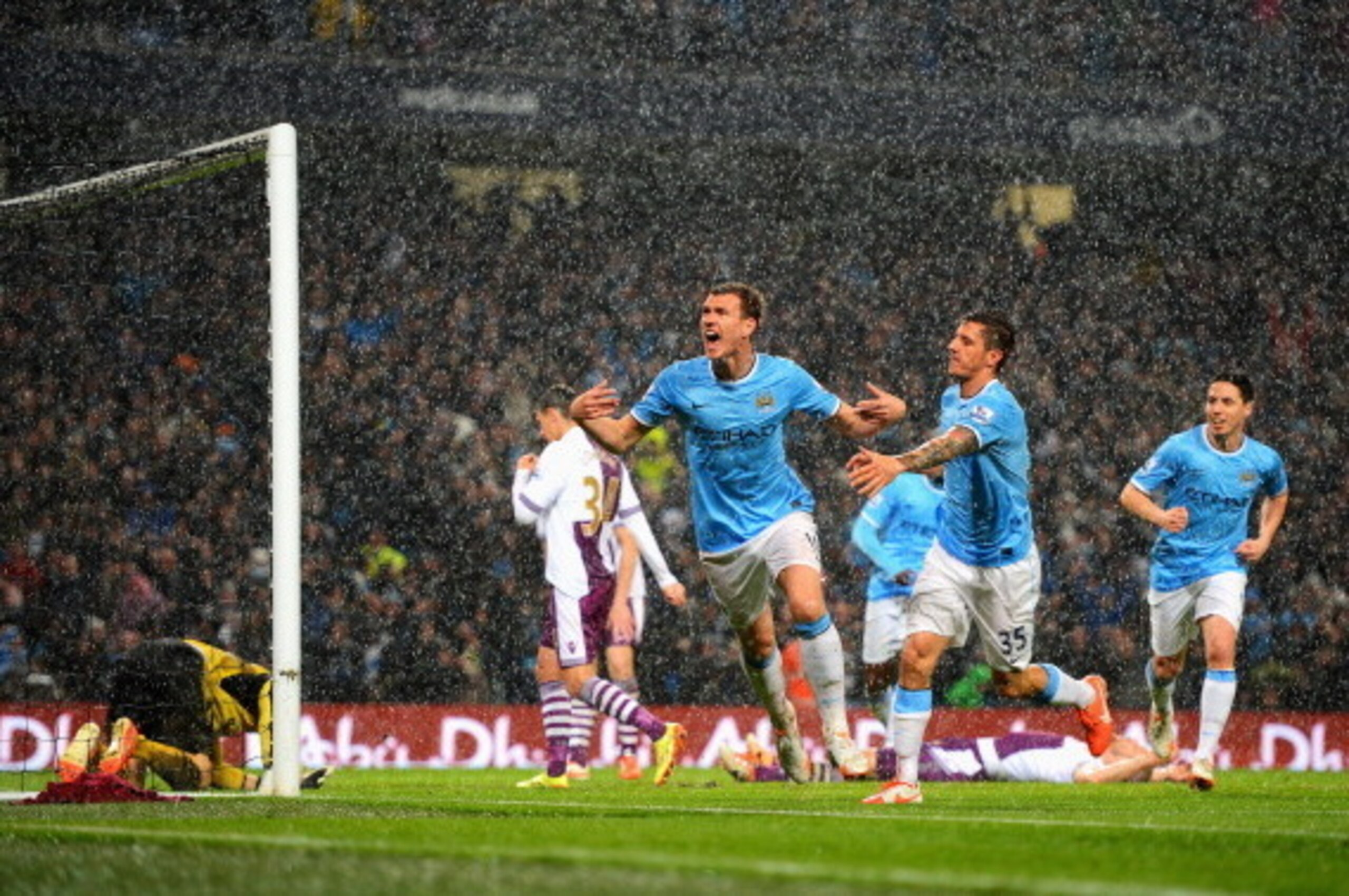 MANCHESTER, ENGLAND - MAY 07: Edin Dzeko of Manchester City celebrates scoring the opening goal during the Barclays Premier League match between Manchester City and Aston Villa at Etihad Stadium on May 7, 2014 in Manchester, England. (Photo by Michael R MANCHESTER, ENGLAND - MAY 07: Edin Dzeko of Manchester City celebrates scoring the opening goal during the Barclays Premier League match between Manchester City and Aston Villa at Etihad Stadium on May 7, 2014 in Manchester, England. (Photo by Michael R