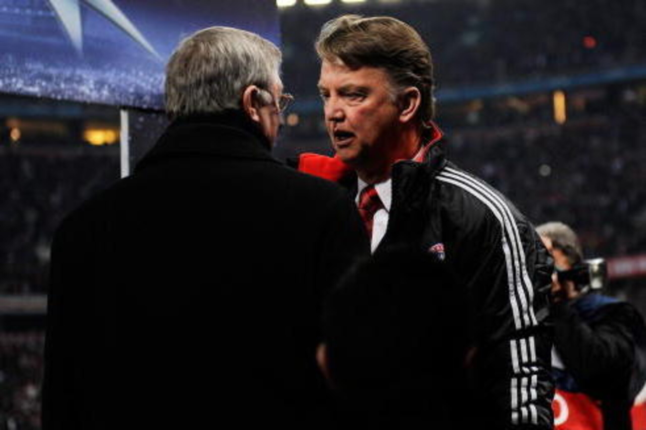 MUNICH, GERMANY - MARCH 30: Louis Van Gaal manager of Bayern Muenchen speaks with Sir Alex Ferguson, manager of Manchester United during the UEFA Champions League quarter final first leg match between Bayern Muenchen and Manchester United at the Allianz A
