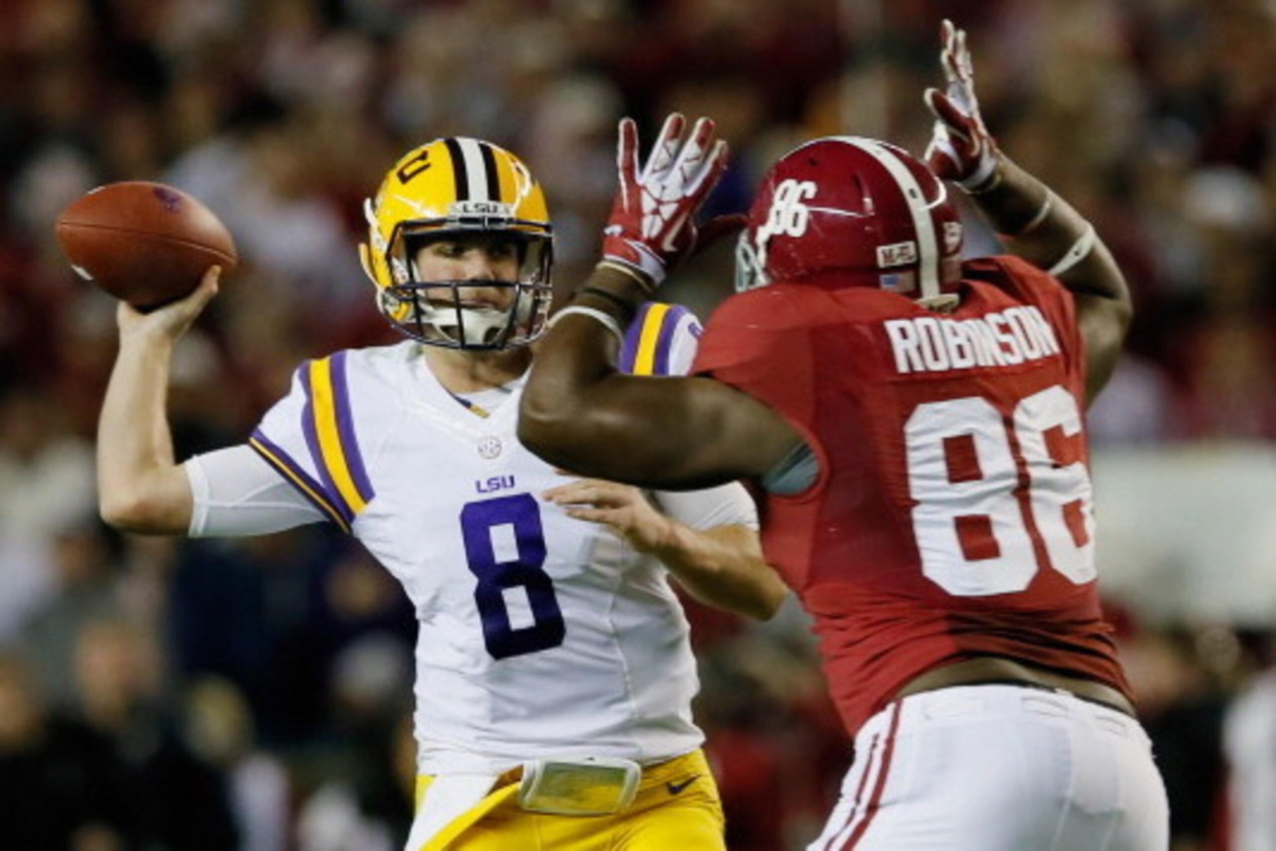 TUSCALOOSA, AL - NOVEMBER 09:  A'Shawn Robinson #86 of the Alabama Crimson Tide pressures Zach Mettenberger #8 of the LSU Tigers in the first half of the game at Bryant-Denny Stadium on November 9, 2013 in Tuscaloosa, Alabama.  (Photo by Kevin C. Cox/Gett
