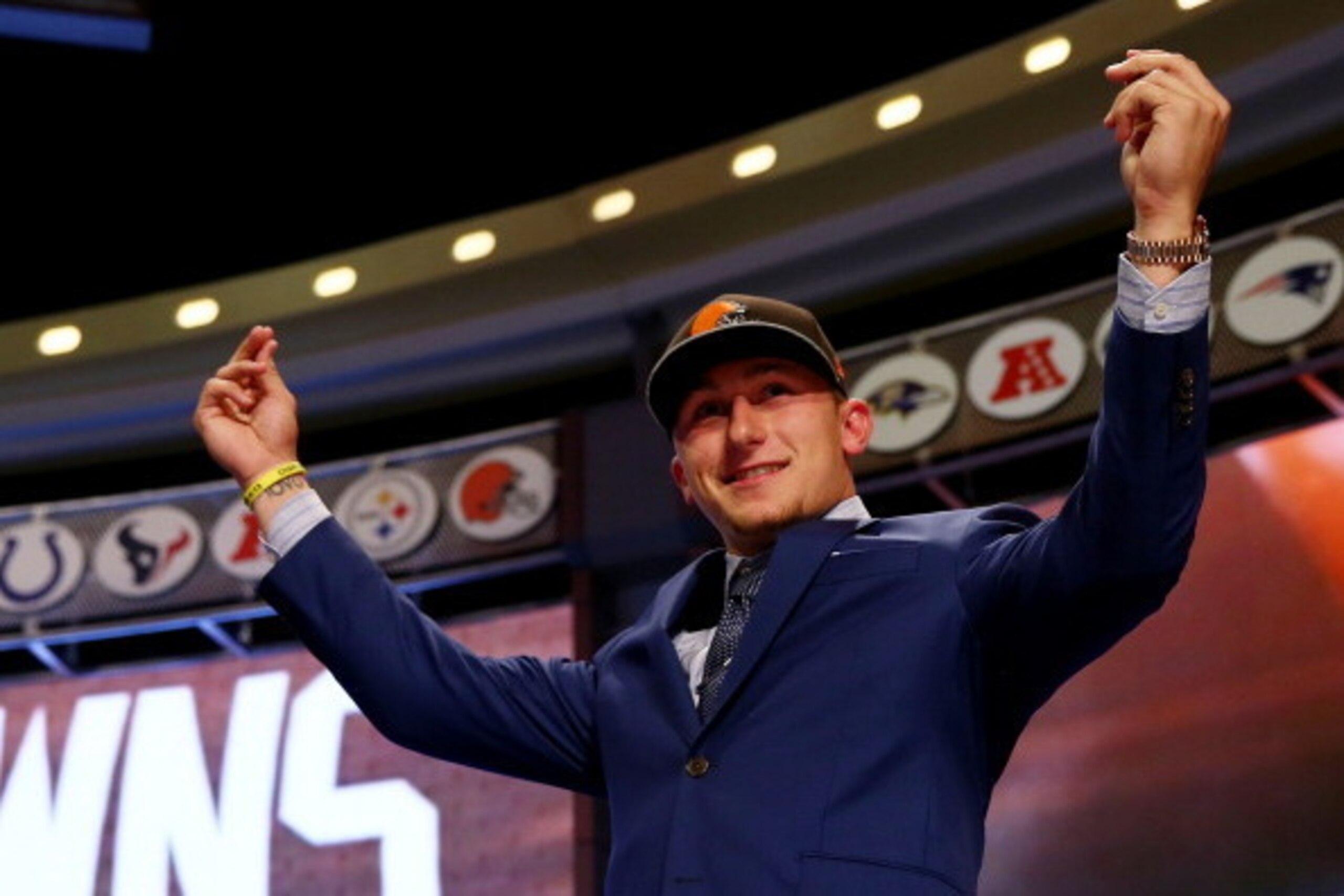 NEW YORK, NY - MAY 08:  Johnny Manziel of the Texas A&M Aggies takes the stage after he was picked #22 overall by the Cleveland Browns during the first round of the 2014 NFL Draft at Radio City Music Hall on May 8, 2014 in New York City.  (Photo by Elsa/G