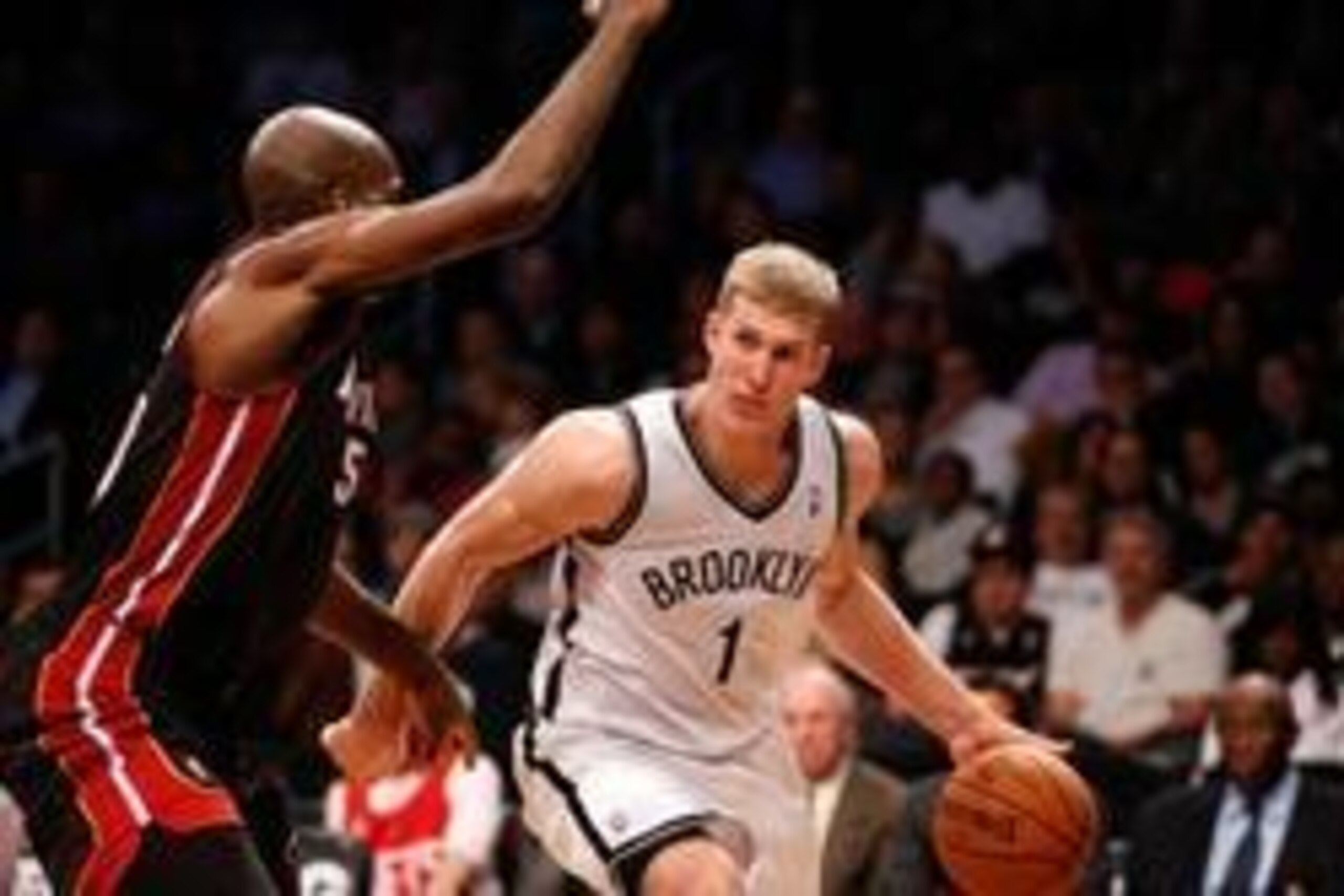 Oct 17, 2013; Brooklyn, NY, USA; Brooklyn Nets power forward Mason Plumlee (1) drives to the net during the fourth quarter against the Miami Heat at Barclays Center. Brooklyn won 86-62.  Mandatory Credit: Anthony Gruppuso-USA TODAY Sports