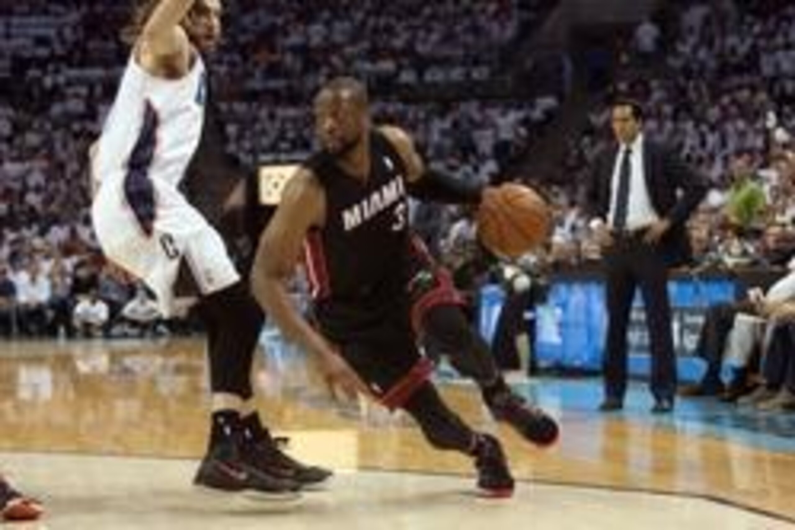 Apr 26, 2014; Charlotte, NC, USA; Miami Heat guard Dwyane Wade (3) drives the ball inside against Charlotte Bobcats forward Josh McRoberts (11) during the first half in game three of the first round of the 2014 NBA Playoffs at Time Warner Cable Arena. Man