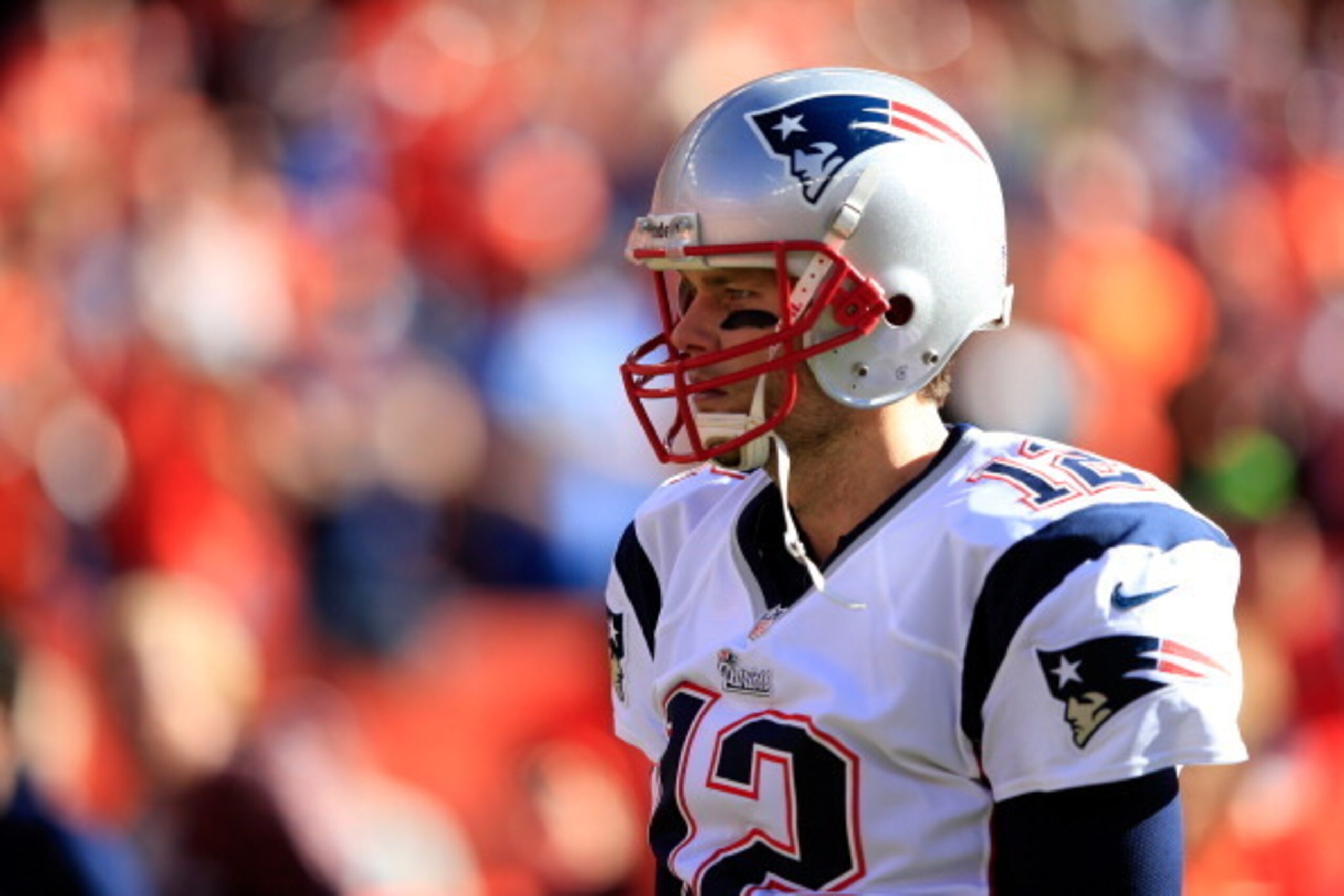 DENVER, CO - JANUARY 19:  Tom Brady #12 of the New England Patriots in action against the Denver Broncos during the AFC Championship game at Sports Authority Field at Mile High on January 19, 2014 in Denver, Colorado.  (Photo by Jamie Squire/Getty Images)