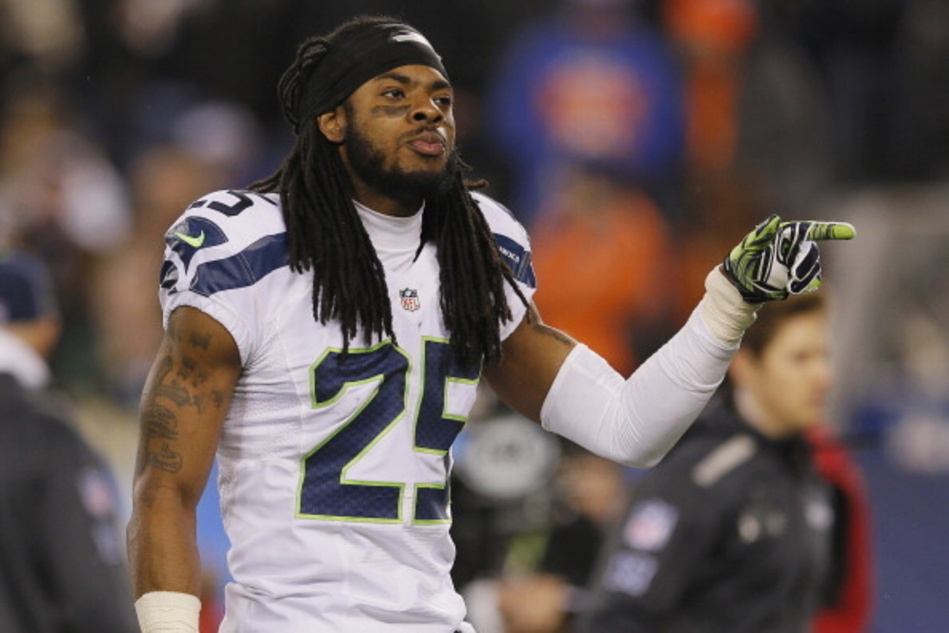 EAST RUTHERFORD, NJ - FEBRUARY 02:  Cornerback Richard Sherman #25 of the Seattle Seahawks walks off the field at the end of the second quarter against the Denver Broncos during Super Bowl XLVIII at MetLife Stadium on February 2, 2014 in East Rutherford, 