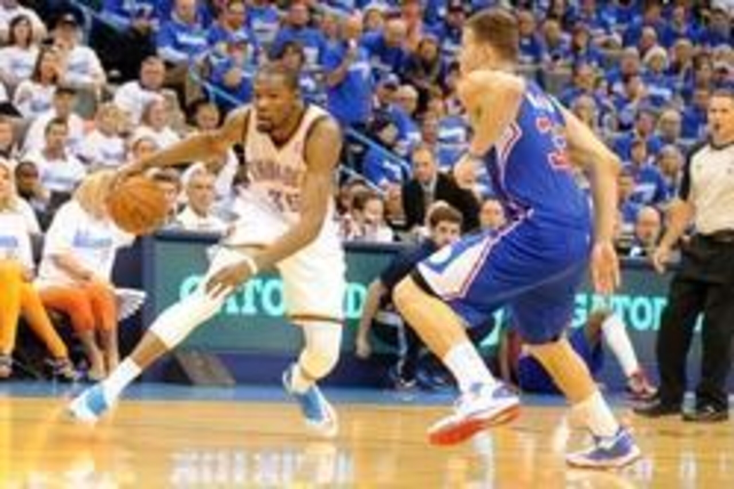 May 7, 2014; Oklahoma City, OK, USA; Oklahoma City Thunder forward Kevin Durant (35) handles the ball against Los Angeles Clippers forward Blake Griffin (32) during the fourth quarter in game two of the second round of the 2014 NBA Playoffs at Chesapeake 