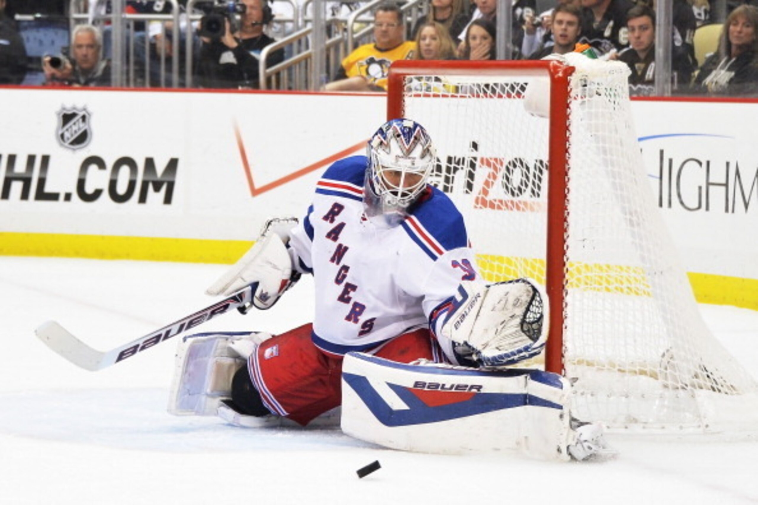 PITTSBURGH, PA - MAY 9:  Goaltender Henrik Lundqvist #30 of the New York Rangers makes a pad save on a shot from the Pittsburgh Penguins in the second period in Game Five of the Second Round of the 2014 NHL Stanley Cup Playoffs on May 9, 2014 at CONSOL En