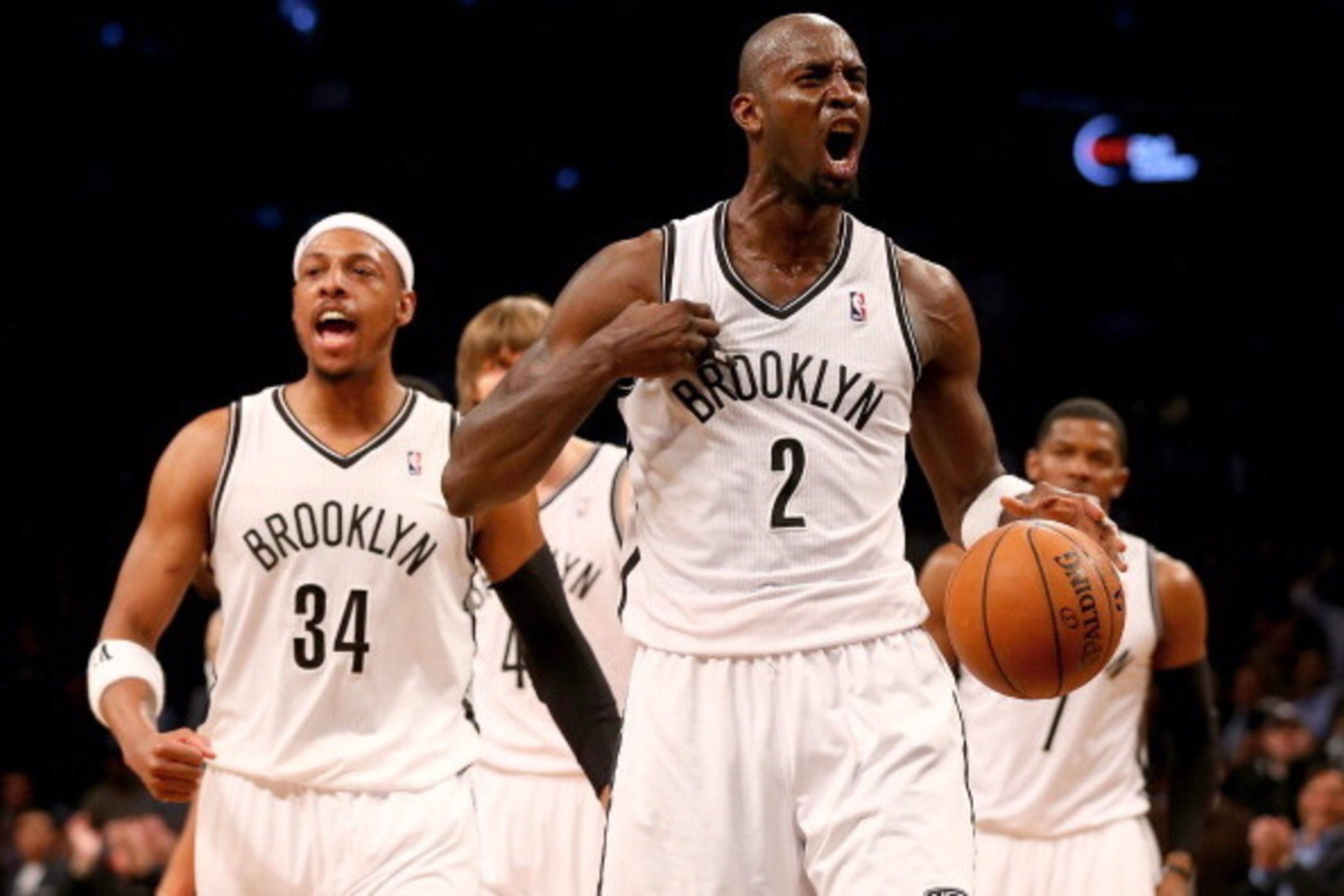 NEW YORK, NY - APRIL 25:  Kevin Garnett #2 of the Brooklyn Nets celebrates with teammate Paul Pierce #34 in the second quarter against the Toronto Raptors in Game Three of the Eastern Conference Quarterfinals during the 2014 NBA Playoffs at the Barclays C