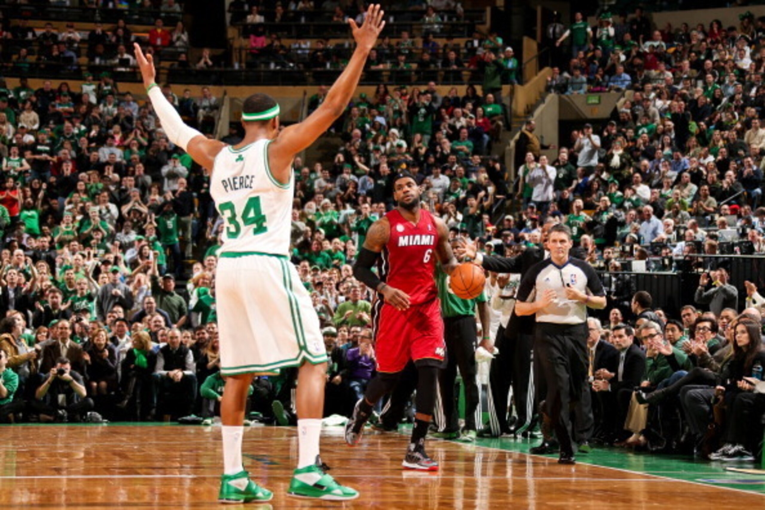 BOSTON, MA - MARCH 18: LeBron James #6 of the Miami Heat advances the ball against Paul Pierce #34 of the Boston Celtics on March 18, 2013 at TD Garden in Boston, Massachusetts.  NOTE TO USER: User expressly acknowledges and agrees that, by downloading an