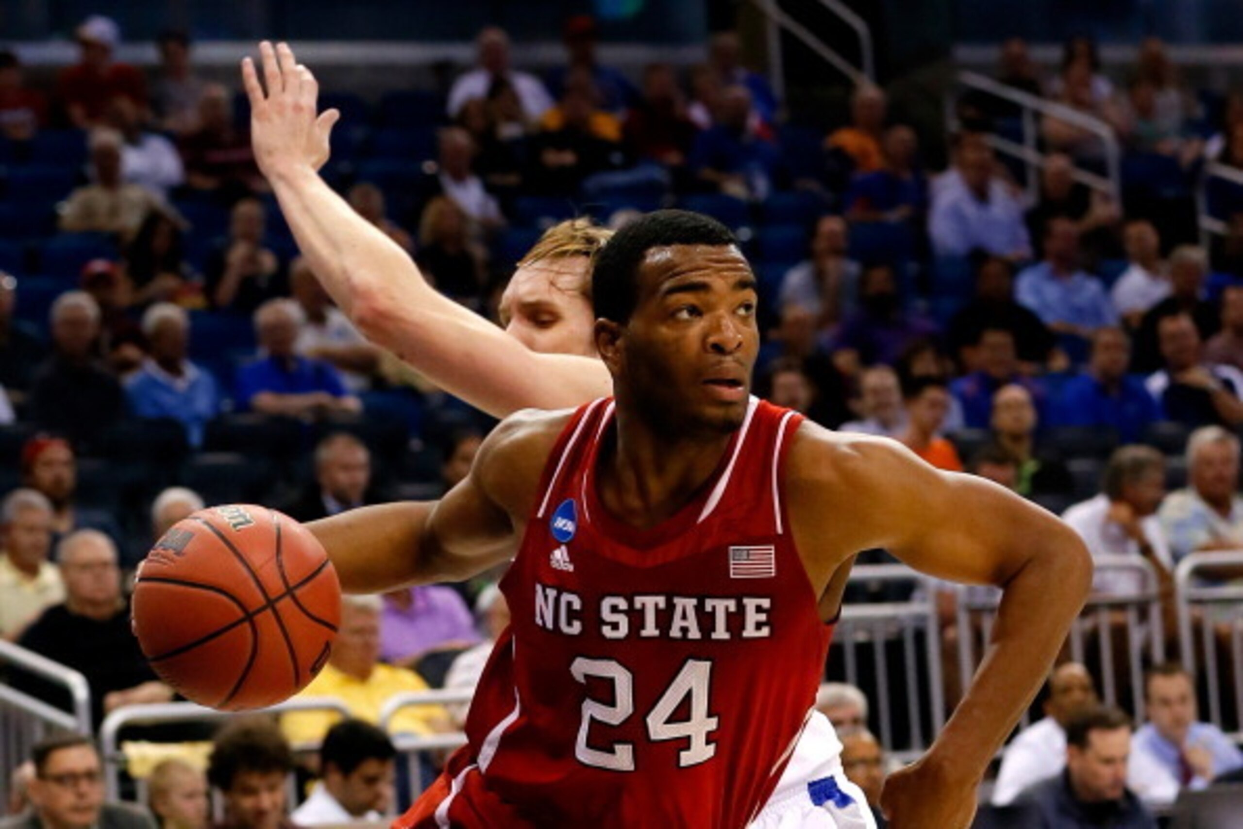 ORLANDO, FL - MARCH 20:  T.J. Warren #24 of the North Carolina State Wolfpack drives to the basket against Jake Barnett #30 of the Saint Louis Billikens during the second round of the 2014 NCAA Men's Basketball Tournament at Amway Center on March 20, 2014