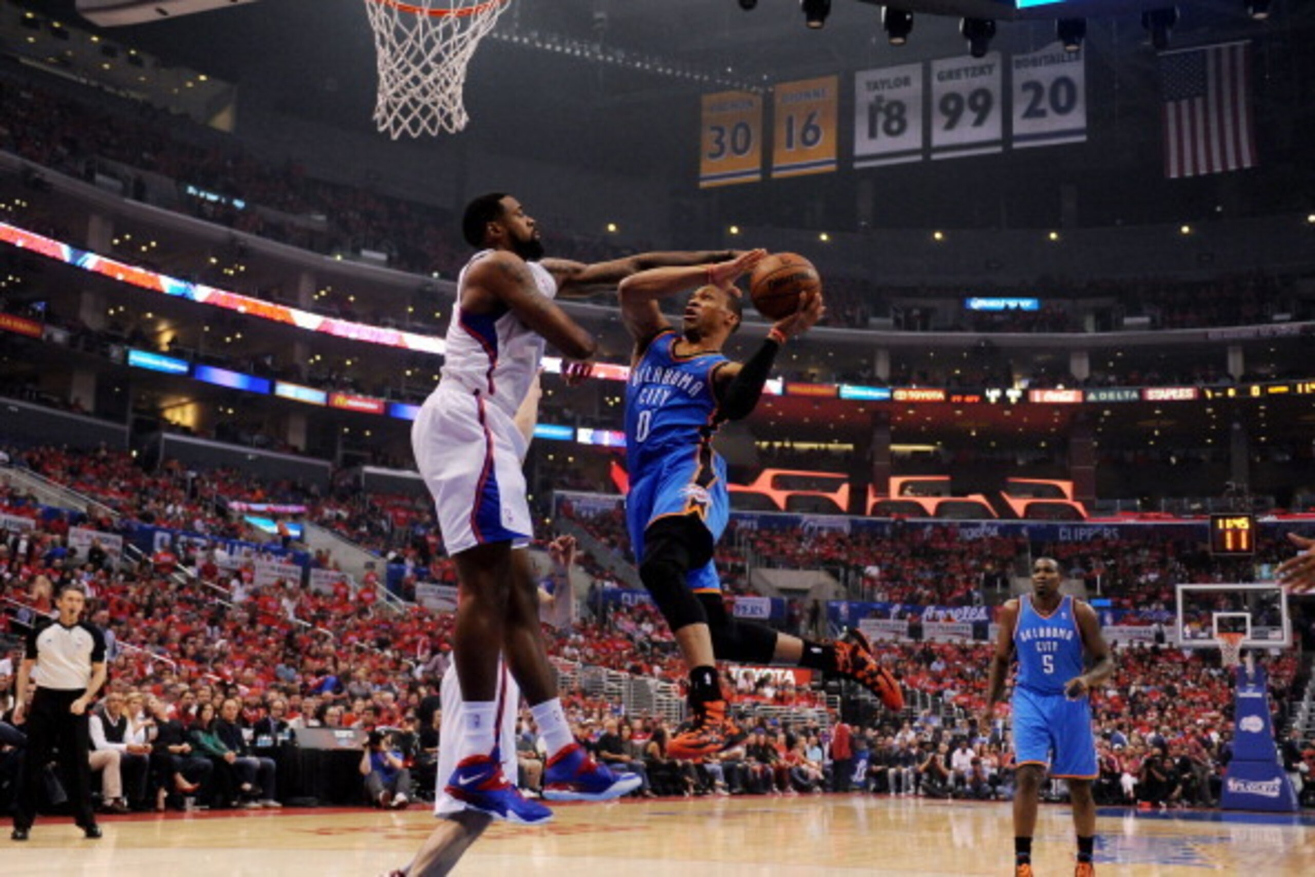 LOS ANGELES, CA - MAY 9: Russell Westbrook #0 of the Oklahoma City Thunder shoots against DeAndre Jordan #6 of the Los Angeles Clippers in Game Three of the Western Conference Semifinals during the 2014 NBA Playoffs at Staples Center on May 9, 2014 in Los