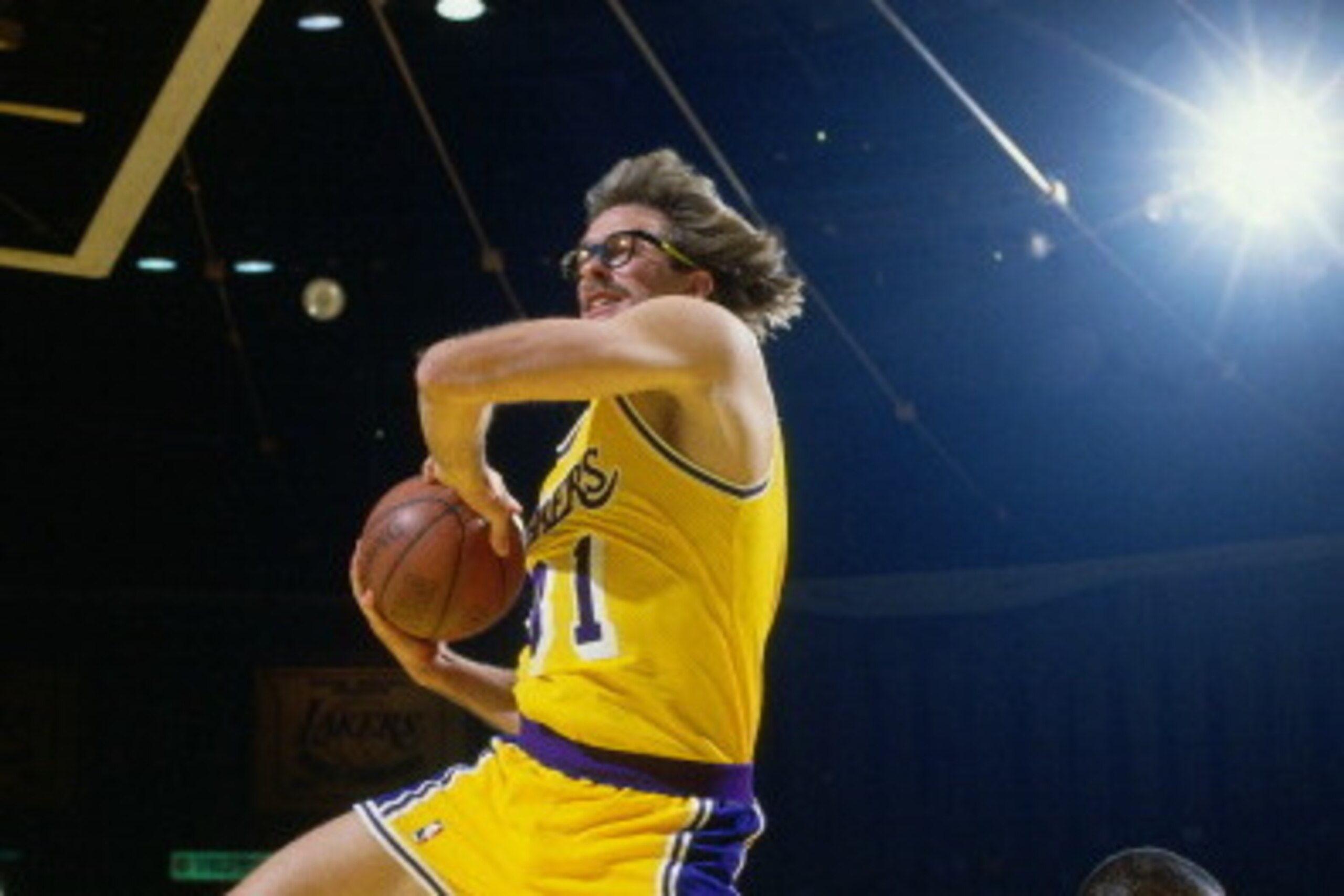 INGLEWOOD, CA - CIRCA 1987: Kurt Rambis #31 of the Los Angeles Lakers rebounds circa 1987 at the Great Western Forum in Inglewood, California. NOTE TO USER: User expressly acknowledges and agrees that, by downloading and or using this photograph, User is 