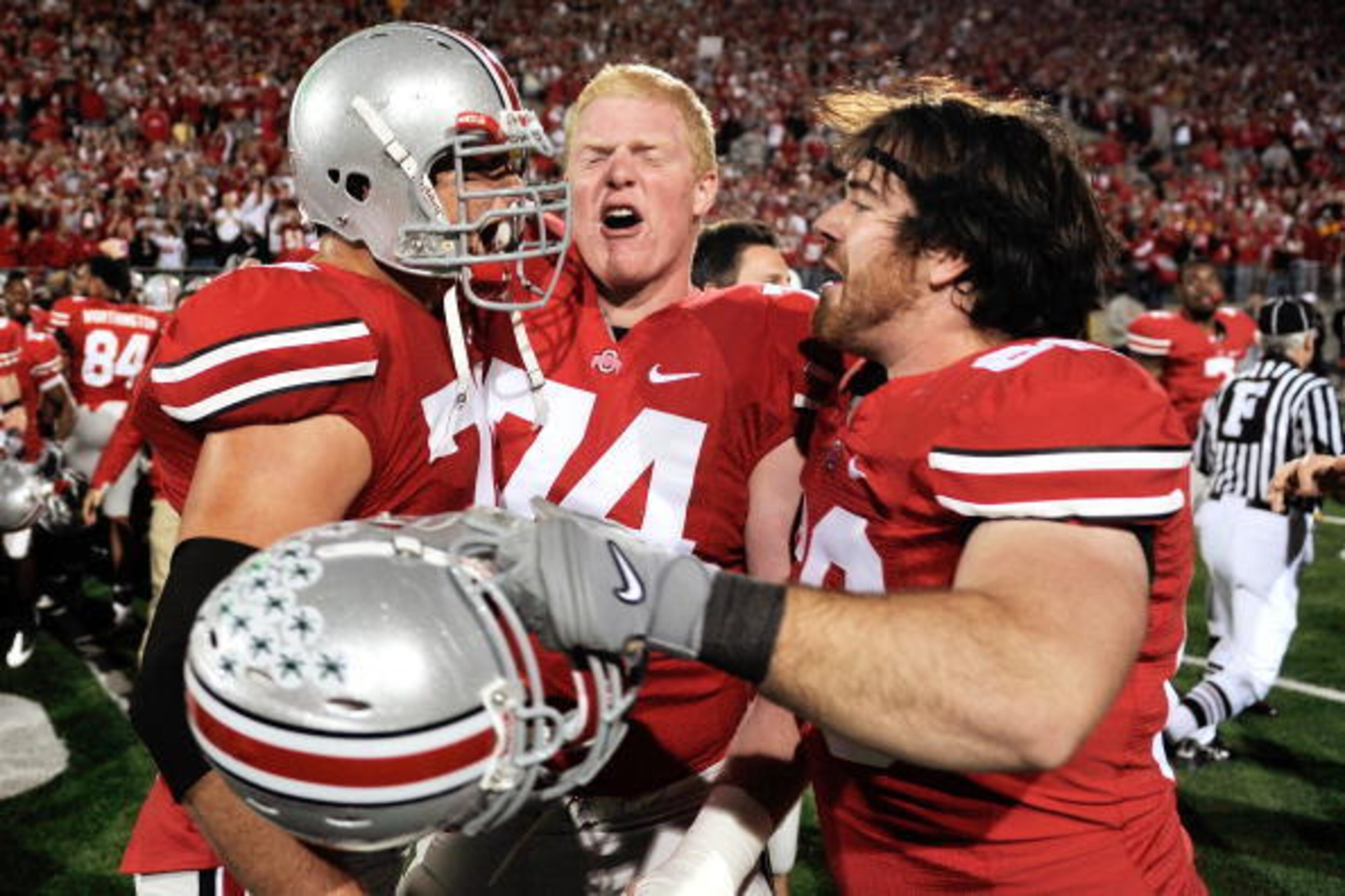 COLUMBUS, OH - NOVEMBER 14: (L-R) J.B. Shugarts #76, Jack Mewhort #74 and Andrew Moses #66, all of the Ohio State Buckeyes, celebrate the Buckeyes' 27-24 overtime victory over the Iowa Hawkeyes at Ohio Stadium on November 14, 2009 in Columbus, Ohio. With COLUMBUS, OH - NOVEMBER 14: (L-R) J.B. Shugarts #76, Jack Mewhort #74 and Andrew Moses #66, all of the Ohio State Buckeyes, celebrate the Buckeyes' 27-24 overtime victory over the Iowa Hawkeyes at Ohio Stadium on November 14, 2009 in Columbus, Ohio. With