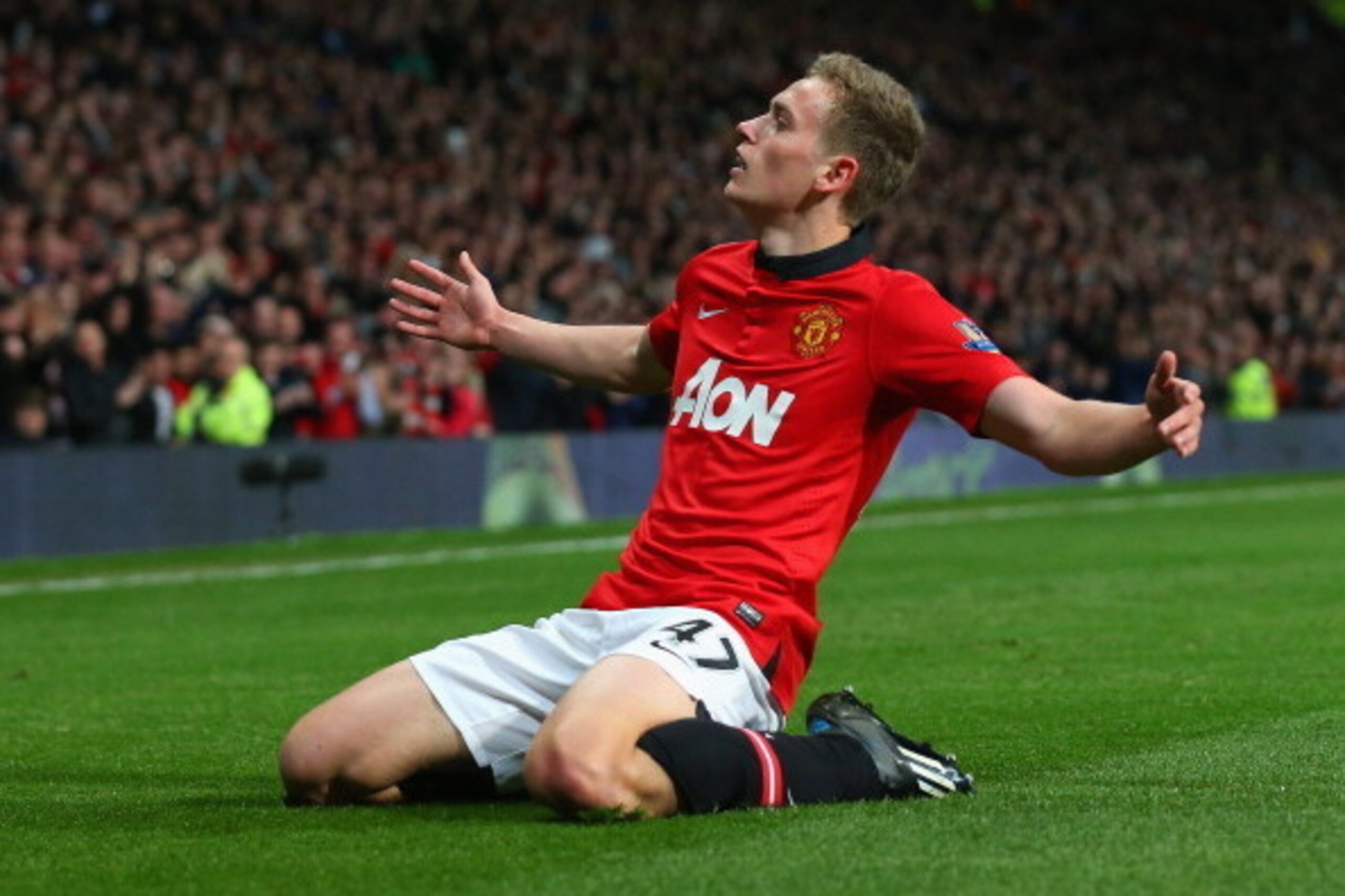 MANCHESTER, ENGLAND - MAY 06:  James Wilson of Manchester United celebrates scoring the second goal during the Barclays Premier League match between Manchester United and Hull City at Old Trafford on May 6, 2014 in Manchester, England.  (Photo by Alex Liv