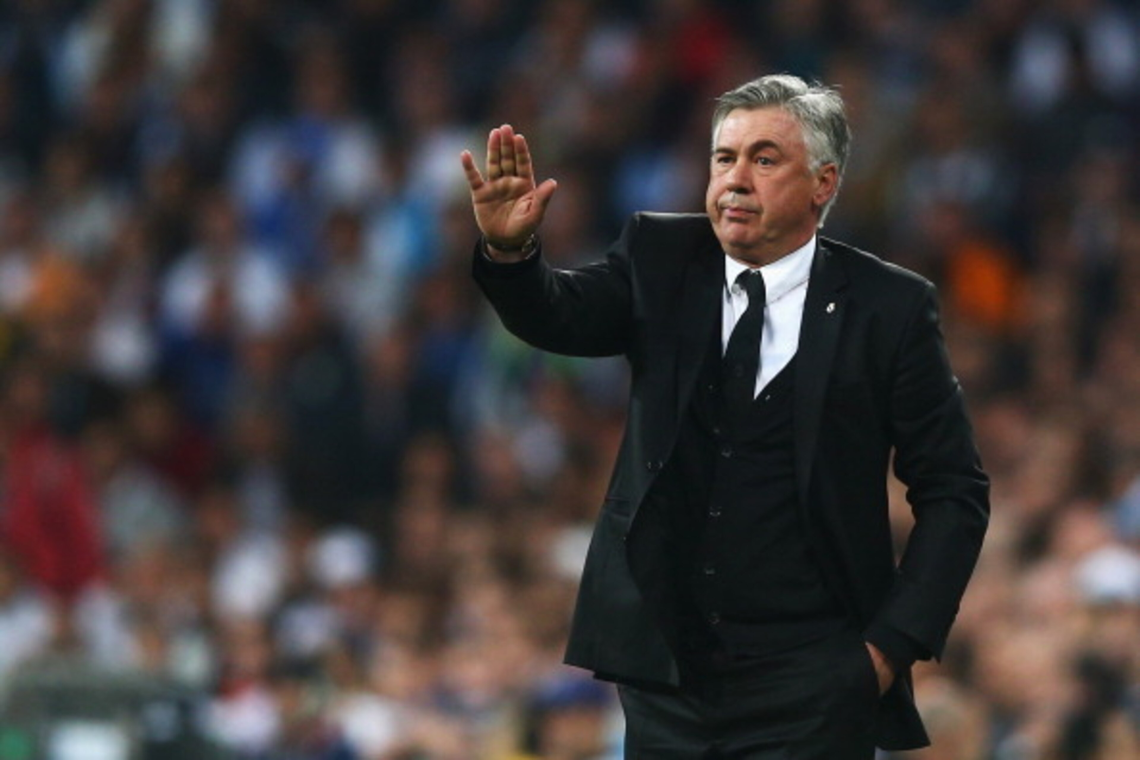 MADRID, SPAIN - APRIL 23: Carlo Ancelotti, coach of Real Madrid gives instructions during the UEFA Champions League semi-final first leg match between Real Madrid and FC Bayern Muenchen at the Estadio Santiago Bernabeu on April 23, 2014 in Madrid, Spain. MADRID, SPAIN - APRIL 23: Carlo Ancelotti, coach of Real Madrid gives instructions during the UEFA Champions League semi-final first leg match between Real Madrid and FC Bayern Muenchen at the Estadio Santiago Bernabeu on April 23, 2014 in Madrid, Spain.