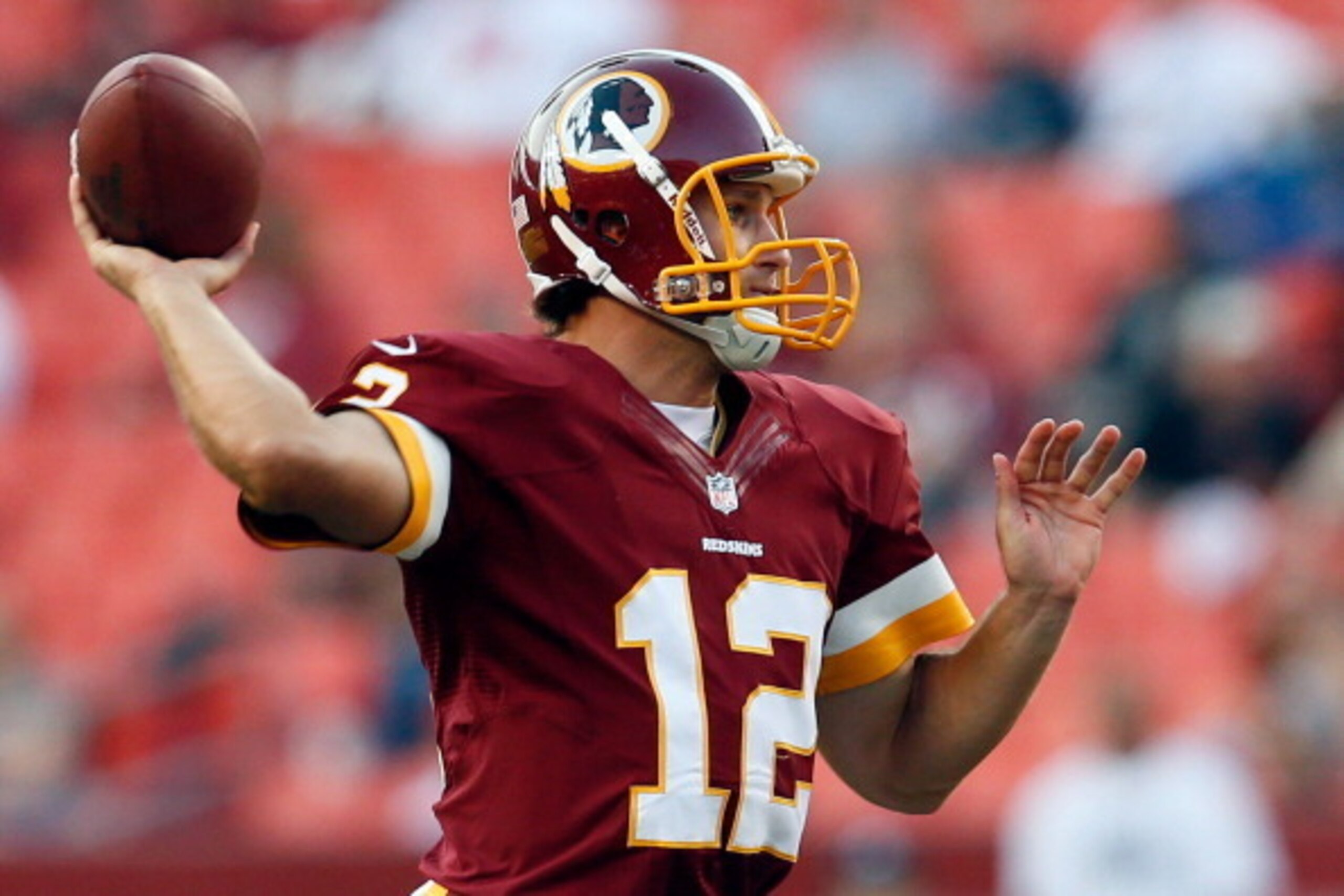 LANDOVER, MD - AUGUST 29:  Quarterback  Kirk Cousins #12 of the Washington Redskins passes against the Tampa Bay Buccaneers at FedExField on August 29, 2012 in Landover, Maryland.  (Photo by Rob Carr/Getty Images)