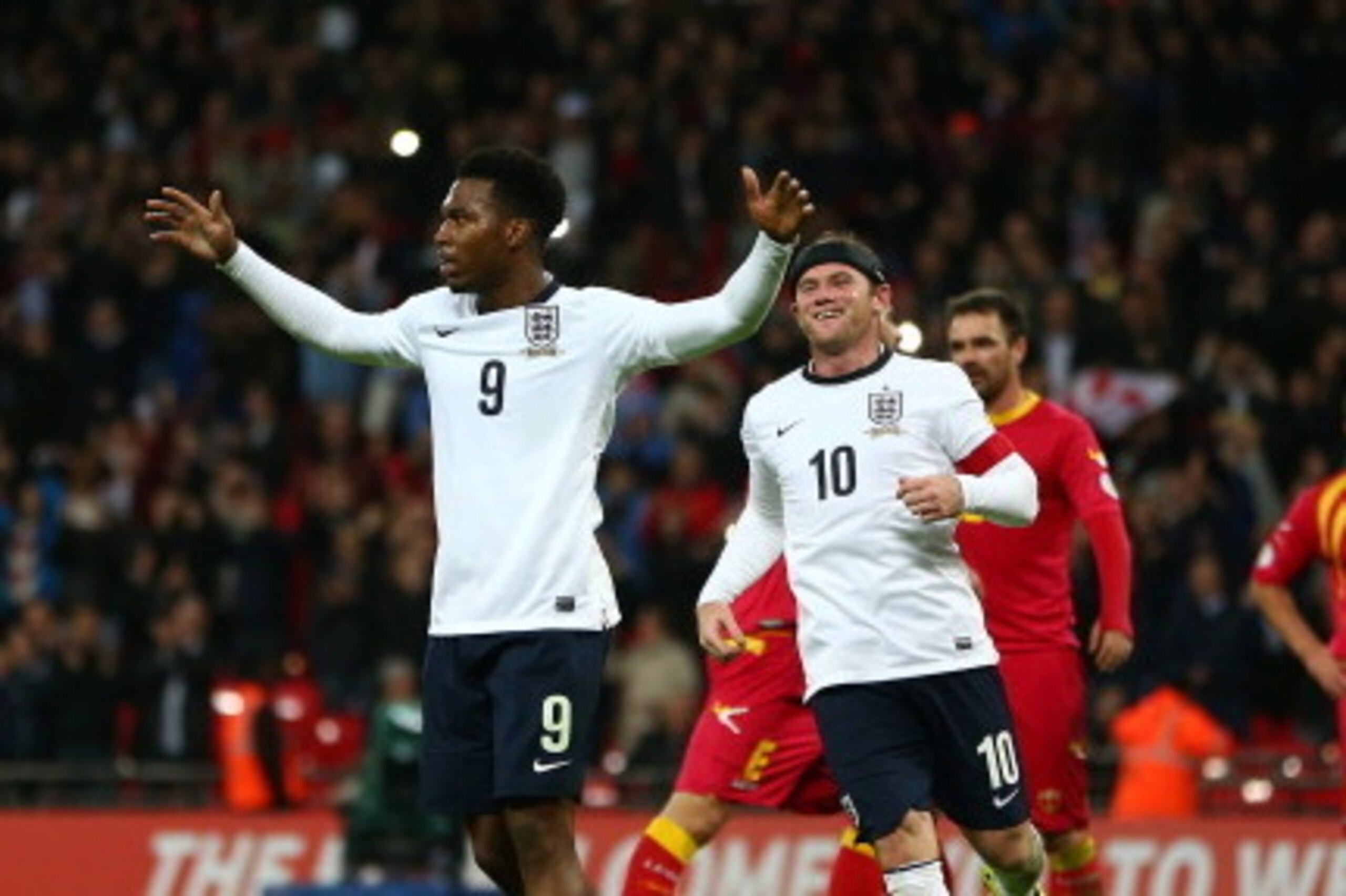 LONDON, ENGLAND - OCTOBER 11:  Daniel Sturridge of England celebrates with Wayne Rooney of England after scoring from penalty spot during the FIFA 2014 World Cup Qualifying Group H match between England and Montenegro at Wembley Stadium on October 11, 201
