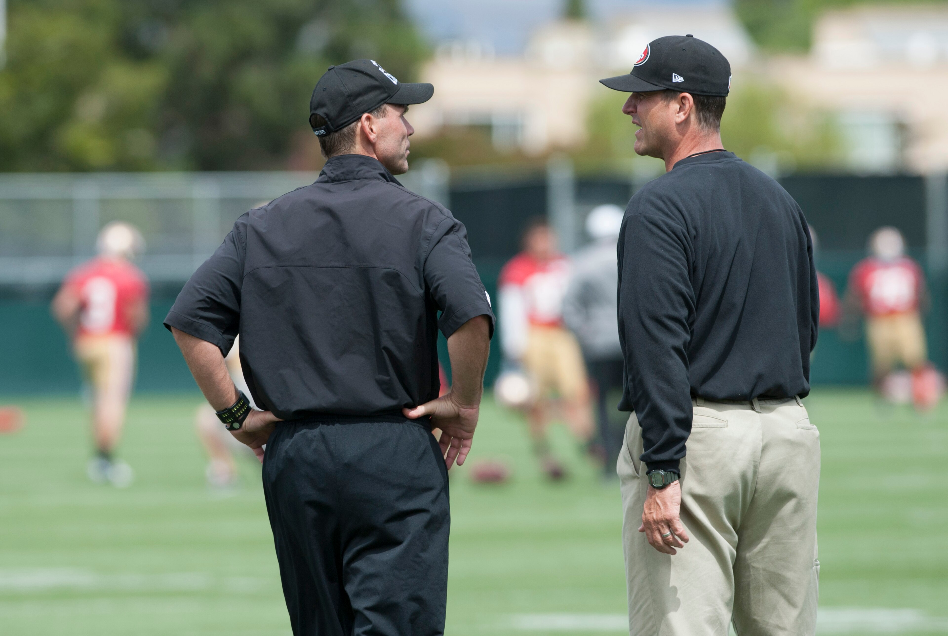 Jun 11, 2013; San Francisco, CA, USA; San Francisco 49ers general manager Trent Baalke (left) and head coach Jim Harbaugh chat during mincamp at San Francisco 49ers training facility. Mandatory Credit: Ed Szczepanski-USA TODAY Sports