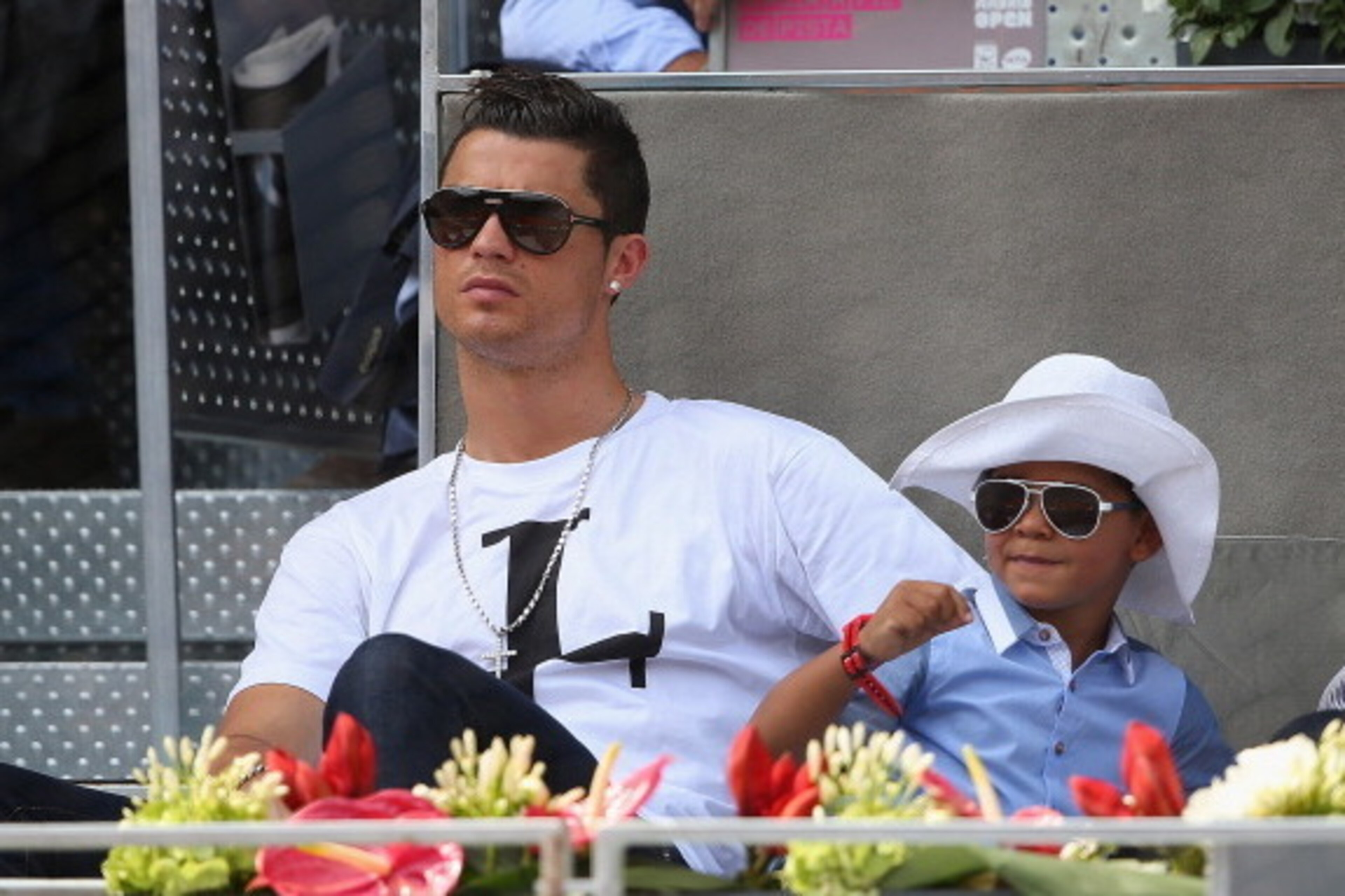 MADRID, SPAIN - MAY 08:  Real Madrid footballer Cristiano Ronaldo and his son Cristiano Ronaldo Junior watch Rafael Nadal of Spain against Jarkko Nieminen of Finland in their third round match during day six of the Mutua Madrid Open tennis tournament at t