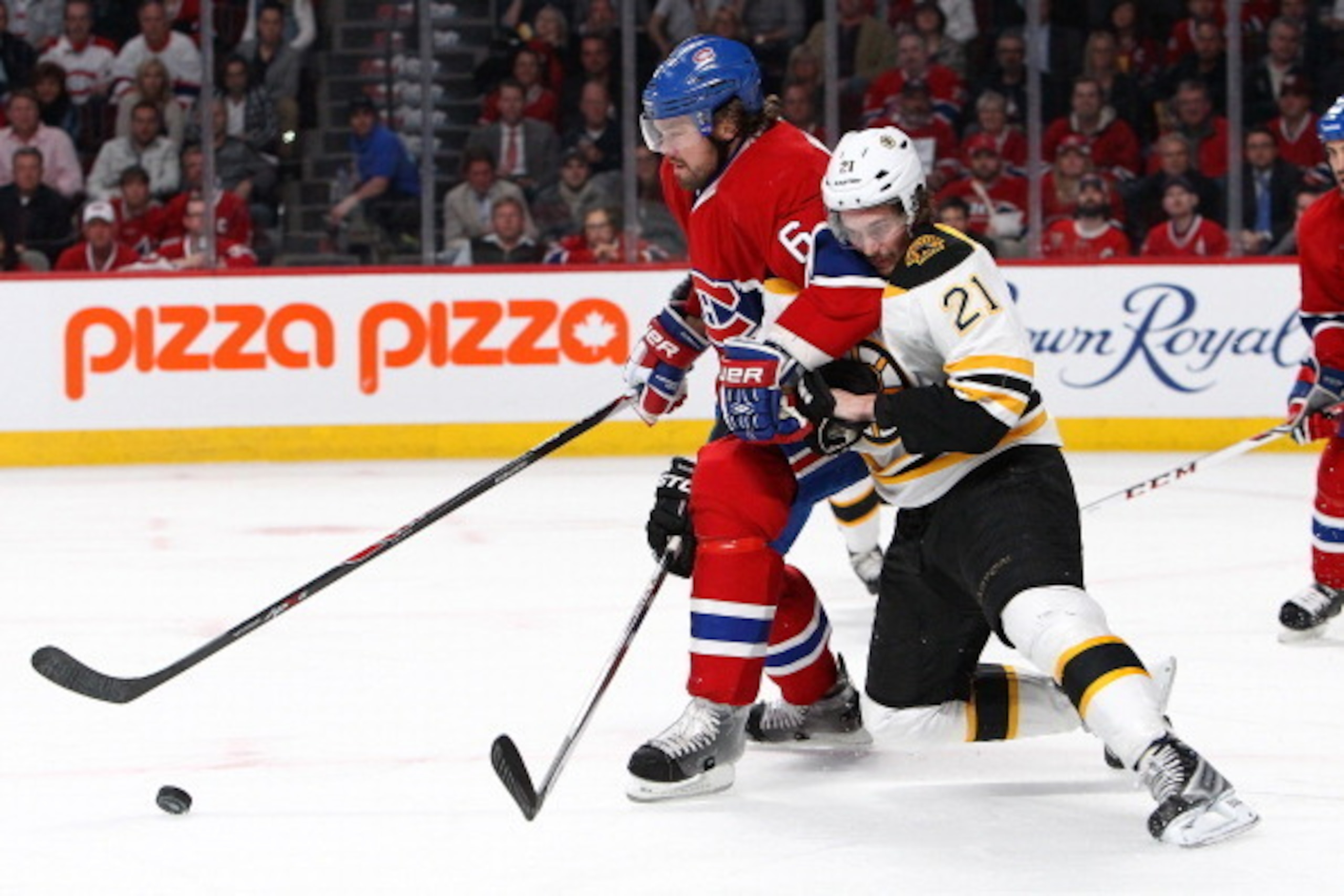 MONTREAL, QC - MAY 8: Loui Eriksson #21 of the Boston Bruins battles for the puck against Douglas Murray #6 of the Montreal Canadiens in Game Four of the Second Round of the 2014 NHL Stanley Cup Playoffs at the Bell Centre on May 8, 2014 in Montreal, Queb